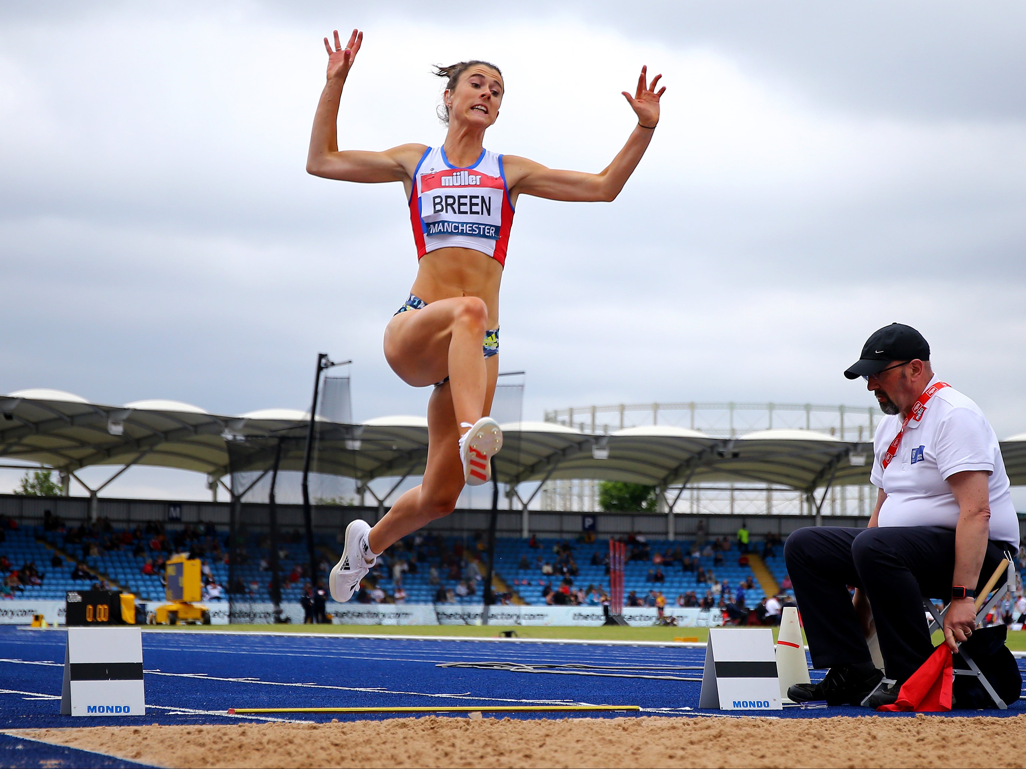 <p>British Paralympian Olivia Breen performing a long jump </p>