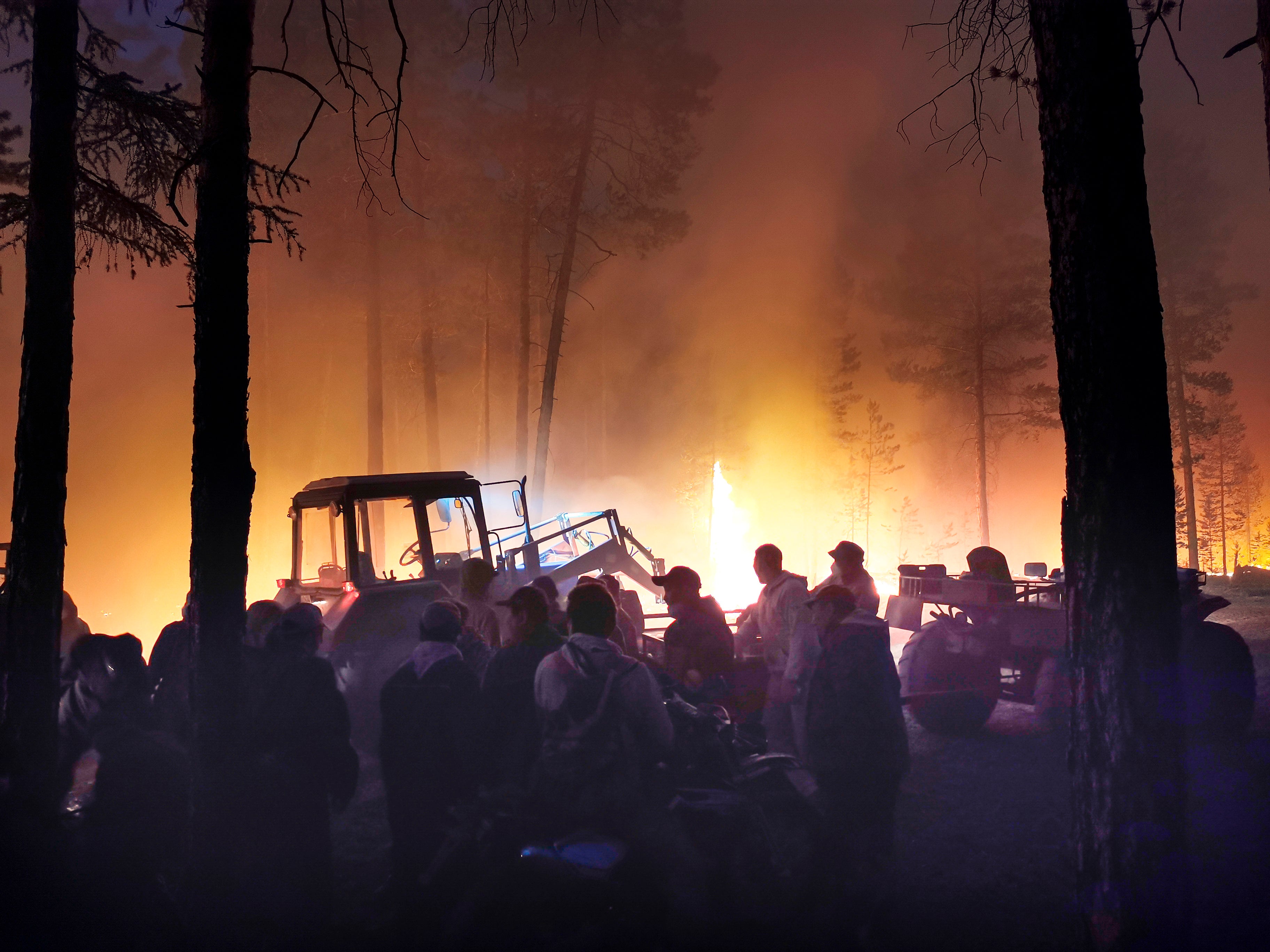 Volunteers prepare to douse a forest fire in the republic of Sakha also known as Yakutia, Russia Far East