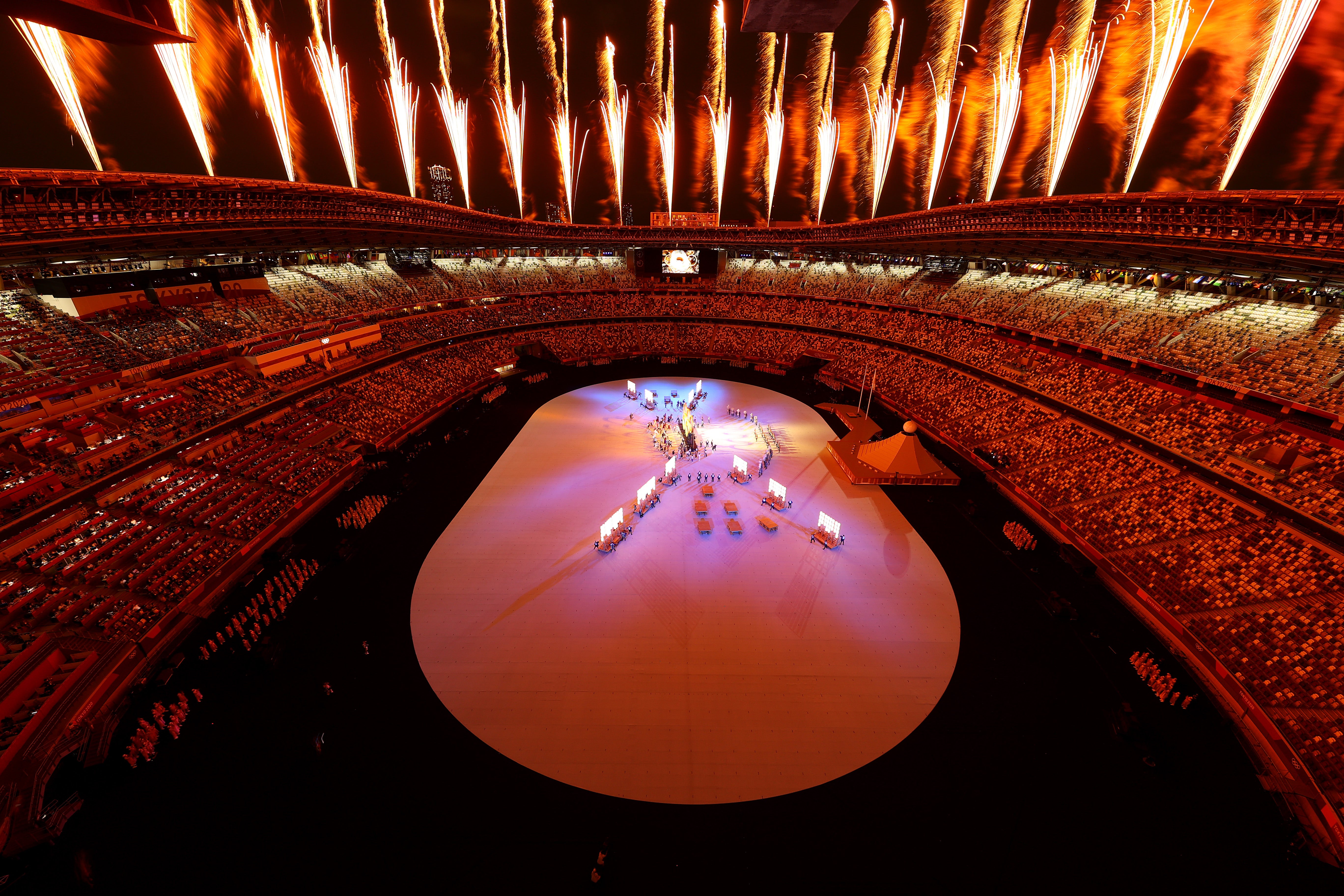 Tokyo’s Olympic Stadium lights up during the opening ceremony
