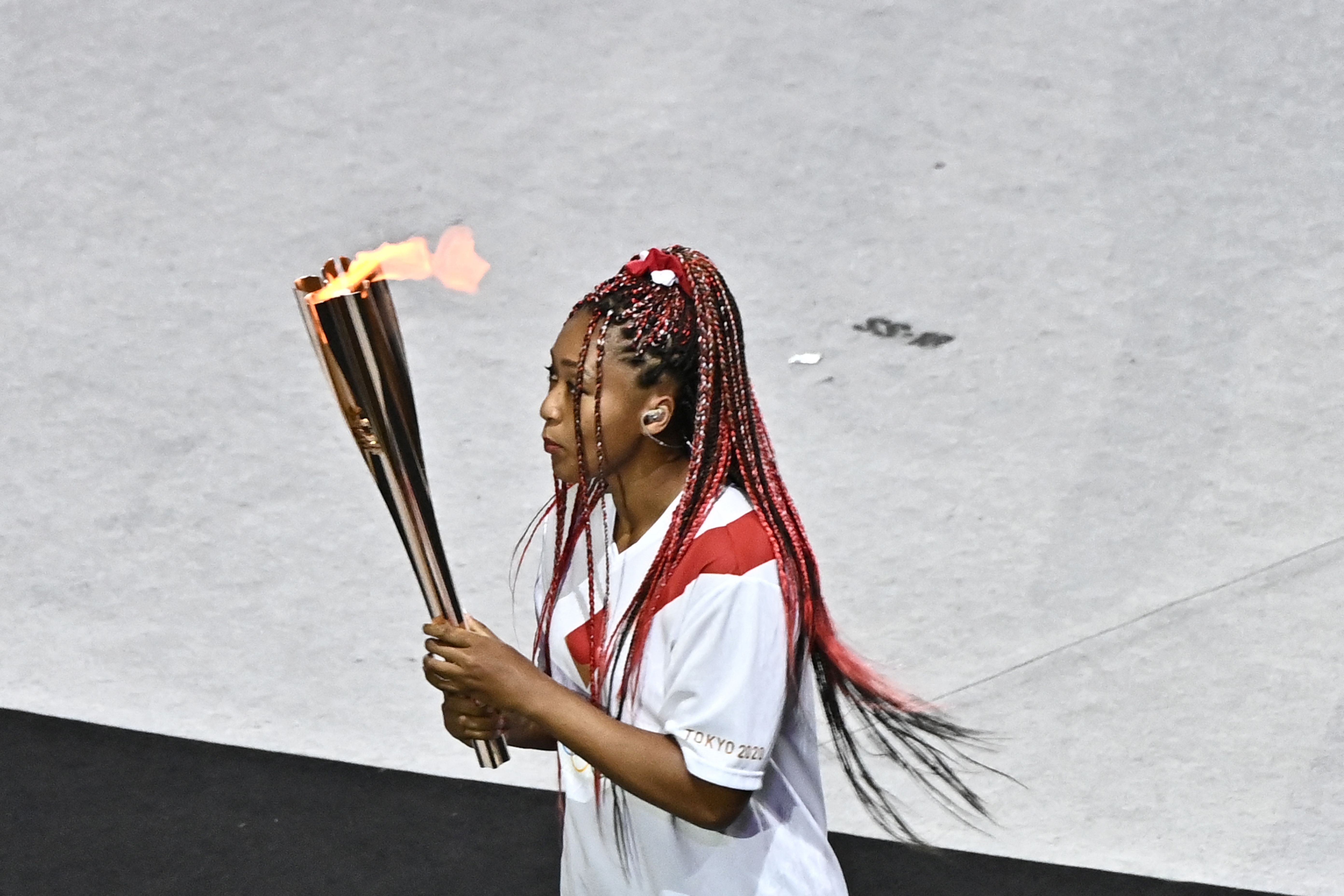 Hideki Matsui carries torch at Olympic Opening Ceremony