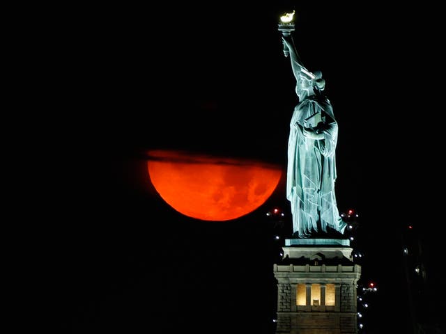 <p>The blood-red moon rising over New York on Thursday night.</p>