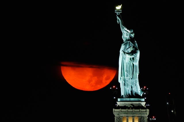 <p>The blood-red moon rising over New York on Thursday night.</p>