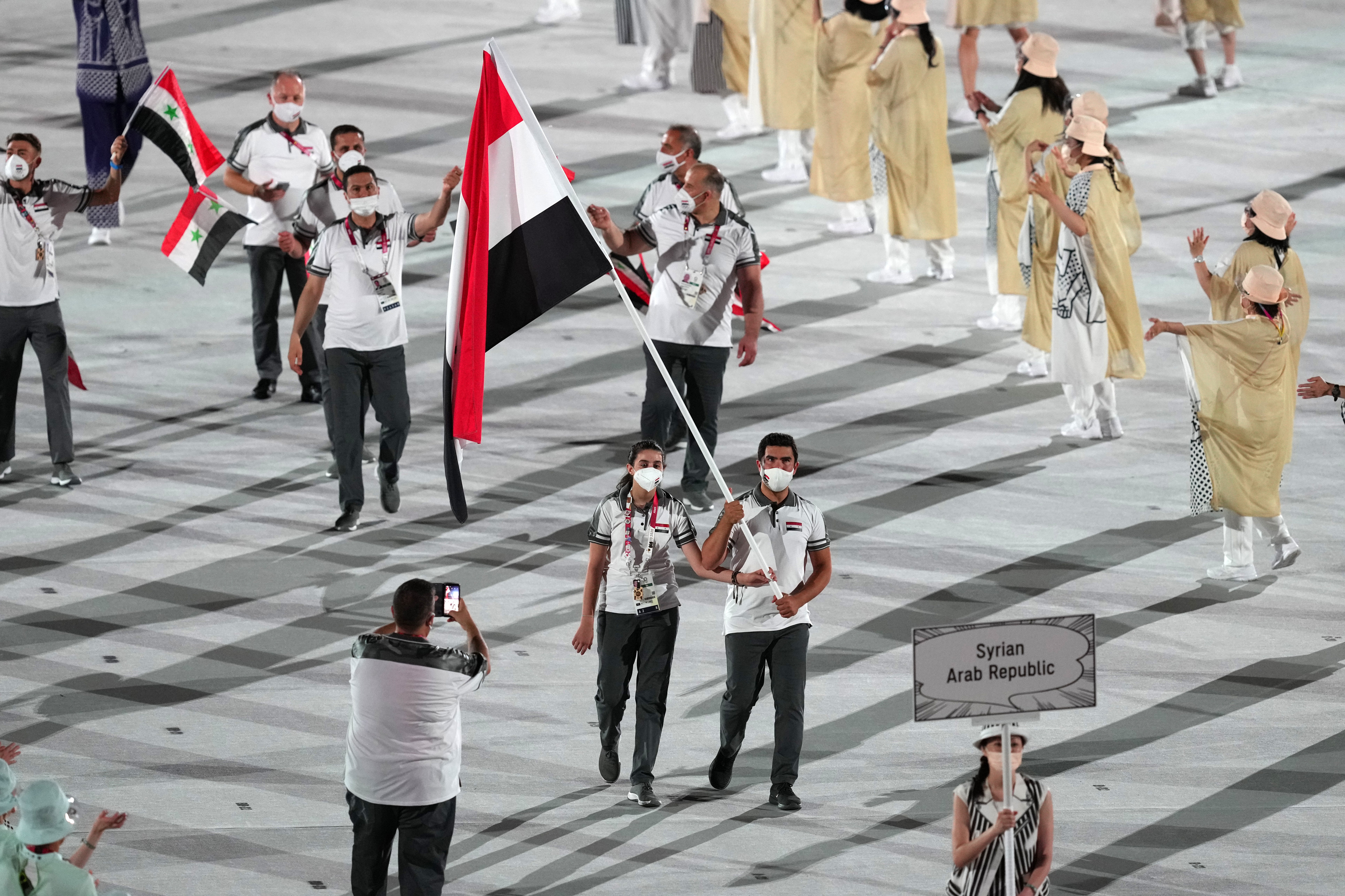 Twelve-year-old Hend Zaza helped carry the Syrian flag into the Olympic Stadium (Martin Rickett/PA)