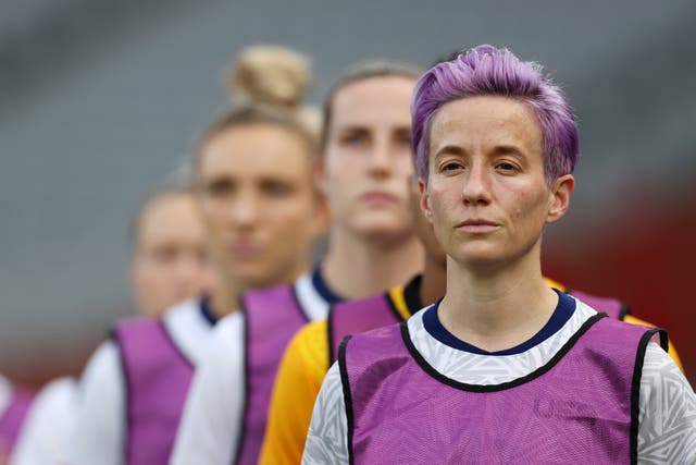 <p> Megan Rapinoe #15 of Team United States reacts as she warms up prior to the Women's First Round Group G match between Sweden and United States during the Tokyo 2020 Olympic Games at Tokyo Stadium on July 21, 2021 in Chofu, Tokyo, Japan</p>
