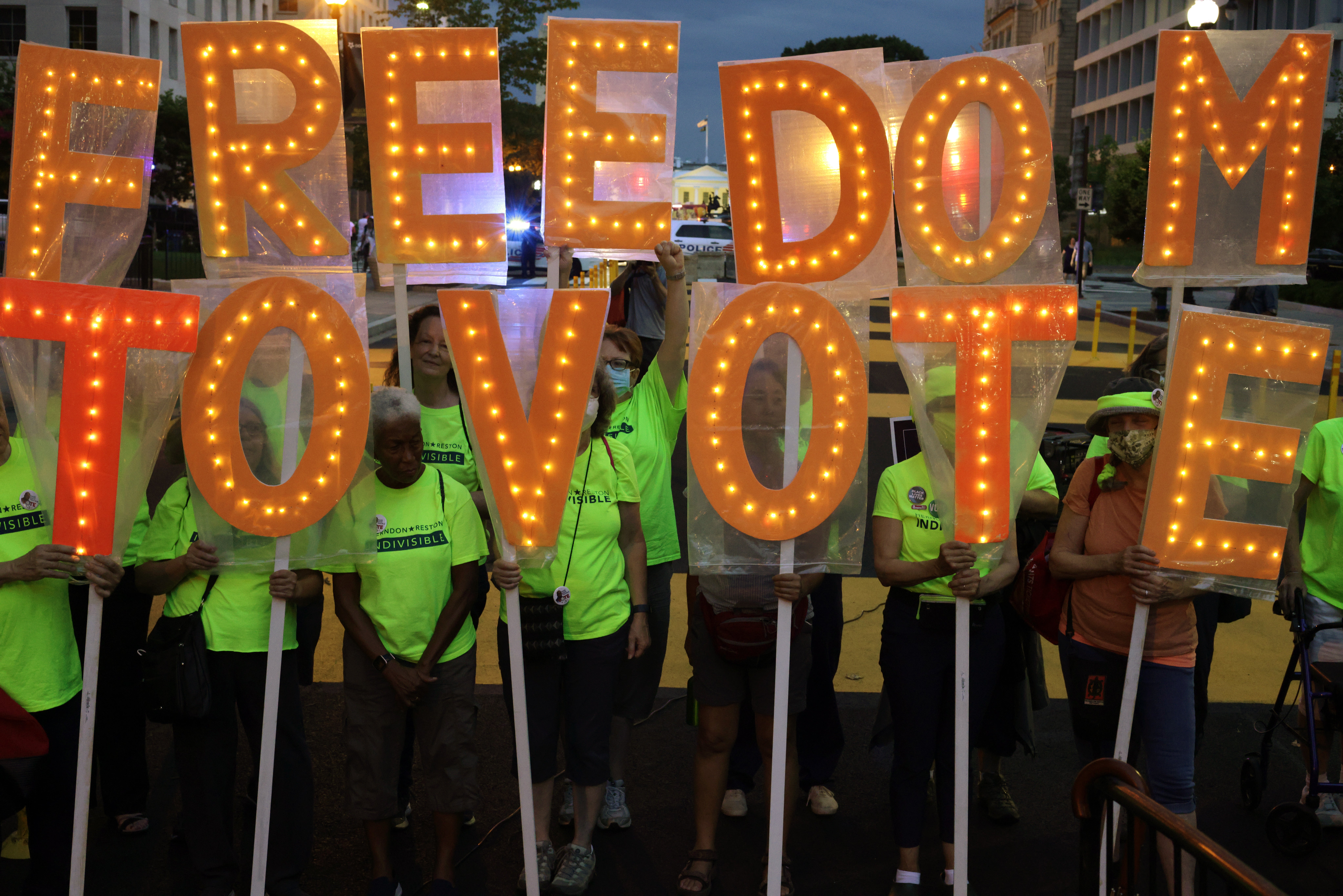 Voting rights activists march in Black Lives Matter Plaza in Washington DC on 17 July.