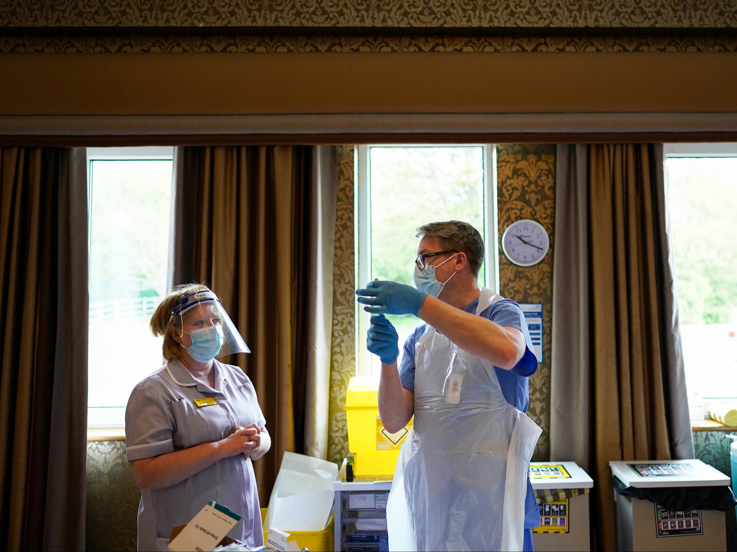 Phil Nugent draws up the Pfizer-BioNTech COVID-19 vaccine in Hexham, North East England