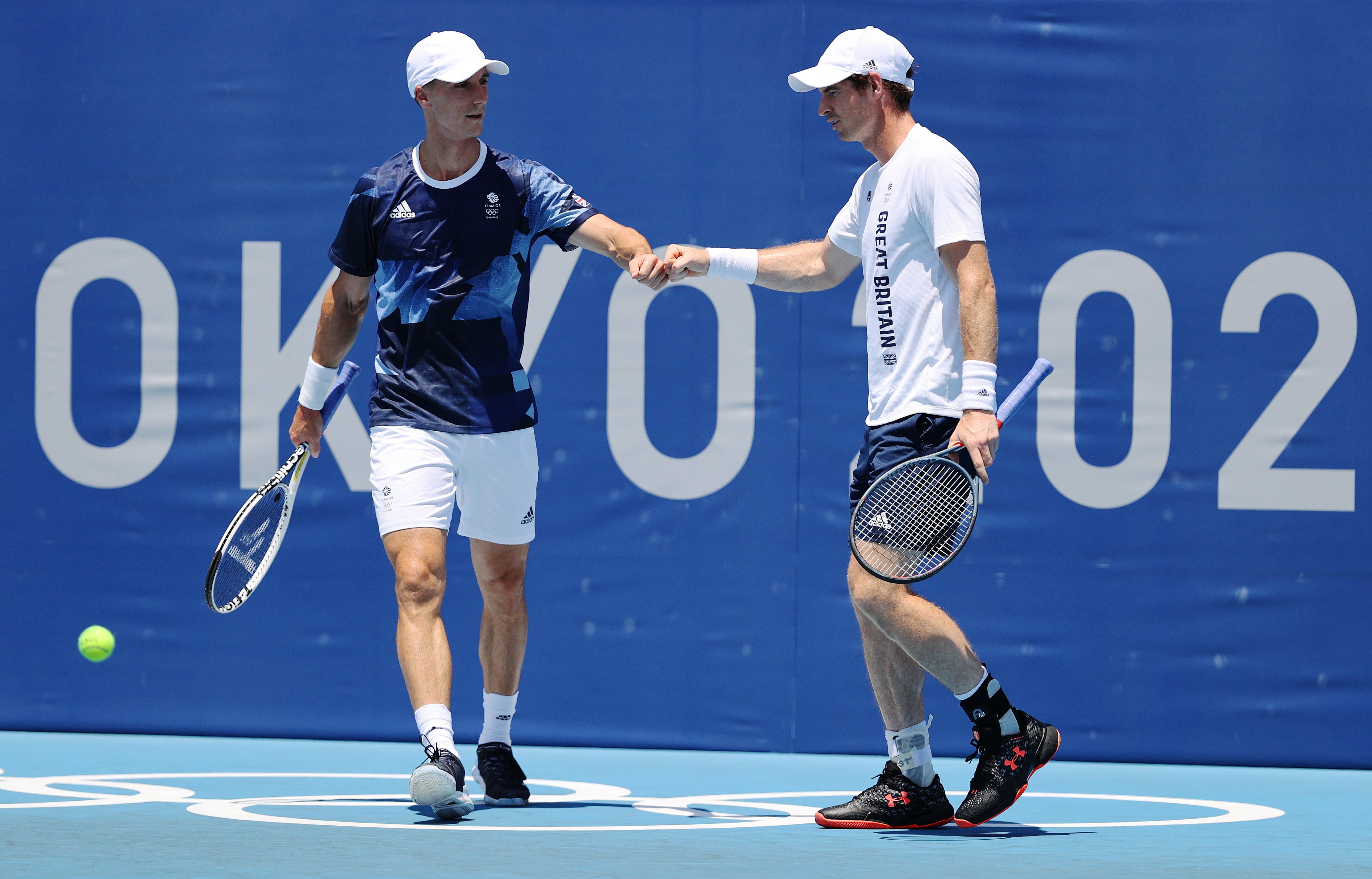 Andy Murray and Joe Salisbury of Team Great Britain fist bump during a practice session at Ariake Tennis Park ahead of the Tokyo 2020 Olympic Games on 24 July 2021 in Tokyo, Japan