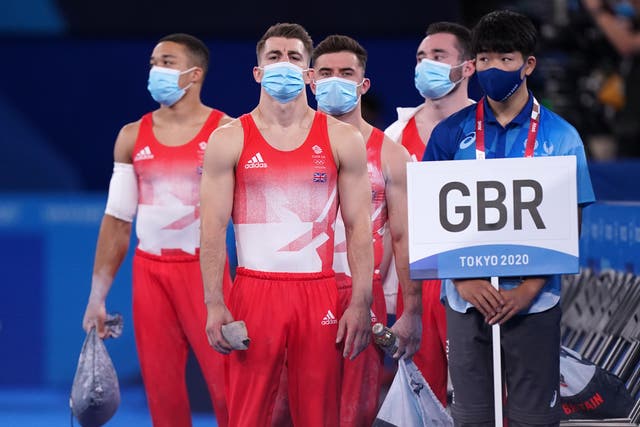 <p>Max Whitlock, second left, gets his gymnastics campaign under way in Tokyo (Mike Egerton/PA)</p>