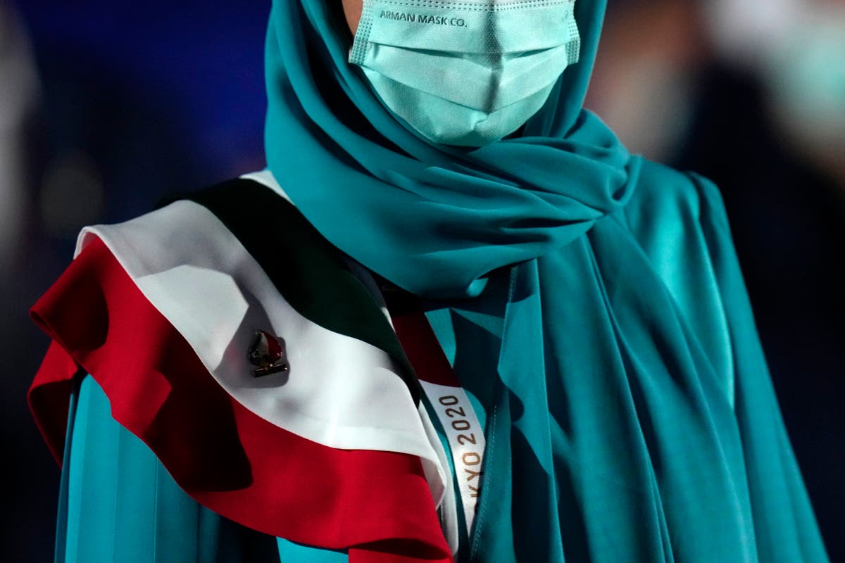 AP PHOTOS: At Olympics opening, zooming in on the outfits