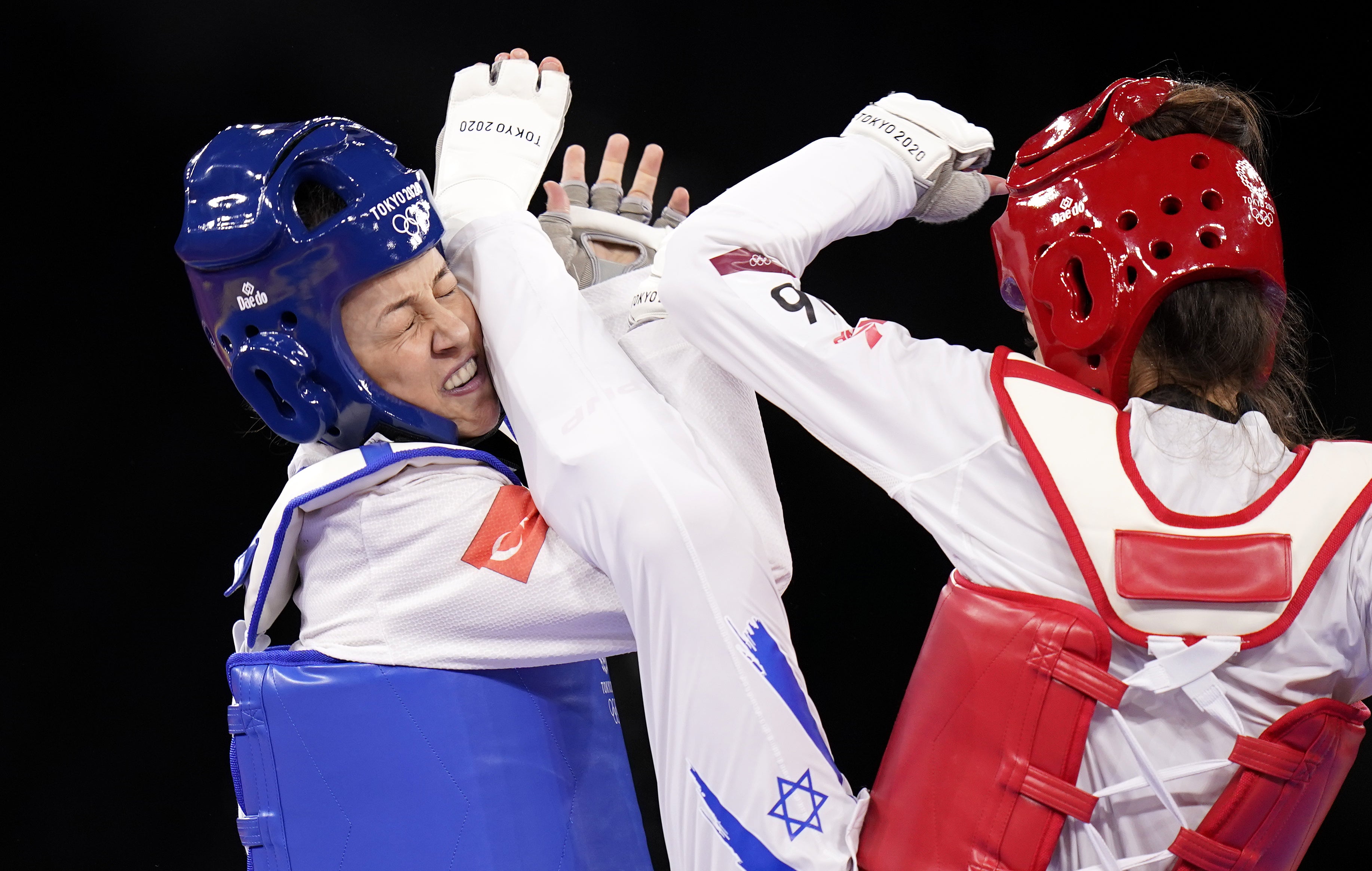 Turkey’s Rukiye Yildirim, left, competes against Israel’s Avishag Semberg in their Women’s Taekwondo 49kg Bronze Medal contest at the Makuhari Messe (Danny Lawson/PA)