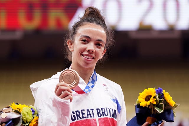 <p>Chelsie Giles shows off her bronze medal, Team GB’s first medal of Tokyo 2020</p>