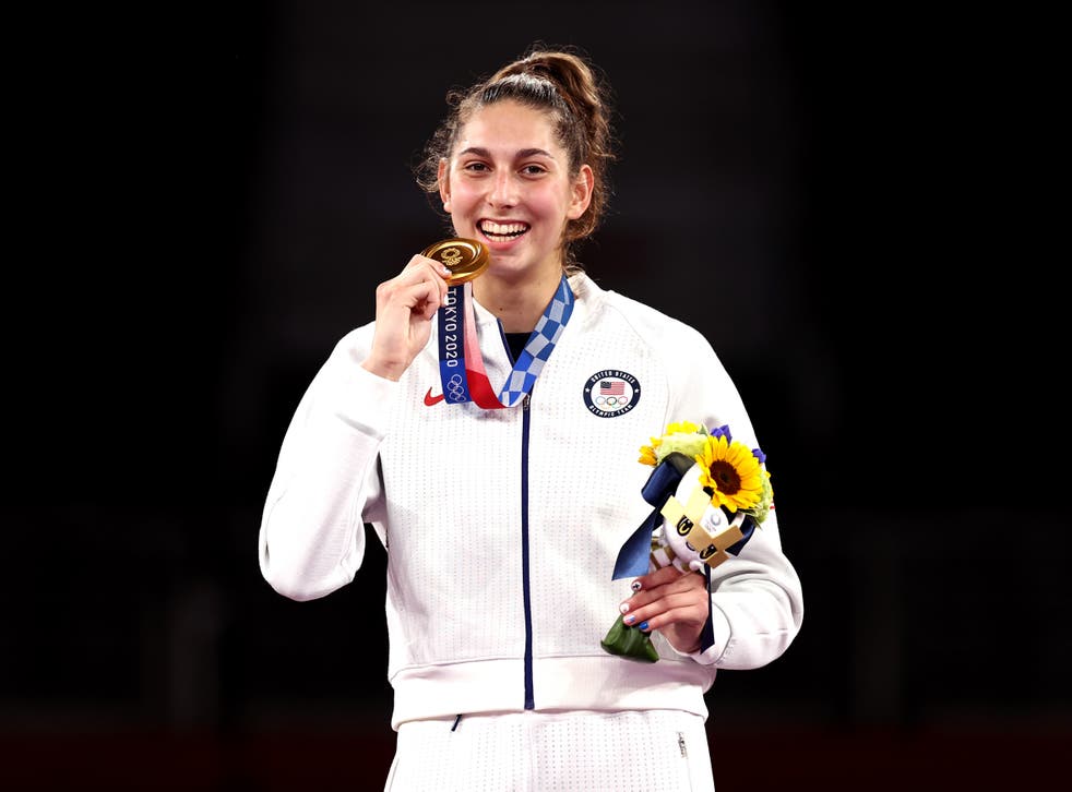 Olympics urges stars to stop biting medals made from recycled phones | The Independent