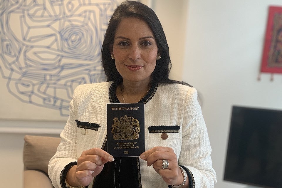 <p>New dawn: the home secretary, Priti Patel, with a post-Brexit ‘blue’ passport</p>