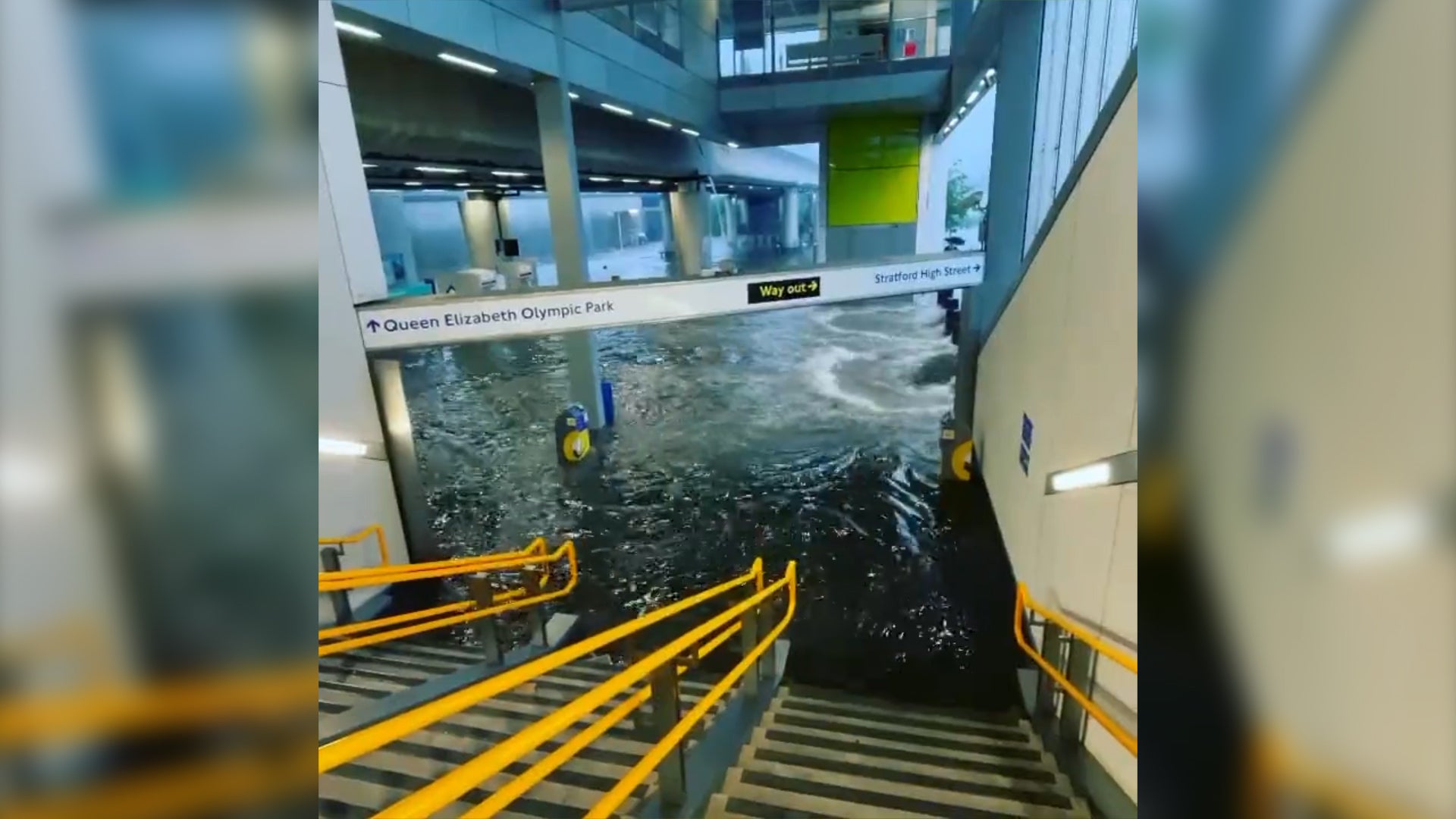 Water gushes into a London Tube station during flash floods in July 2021