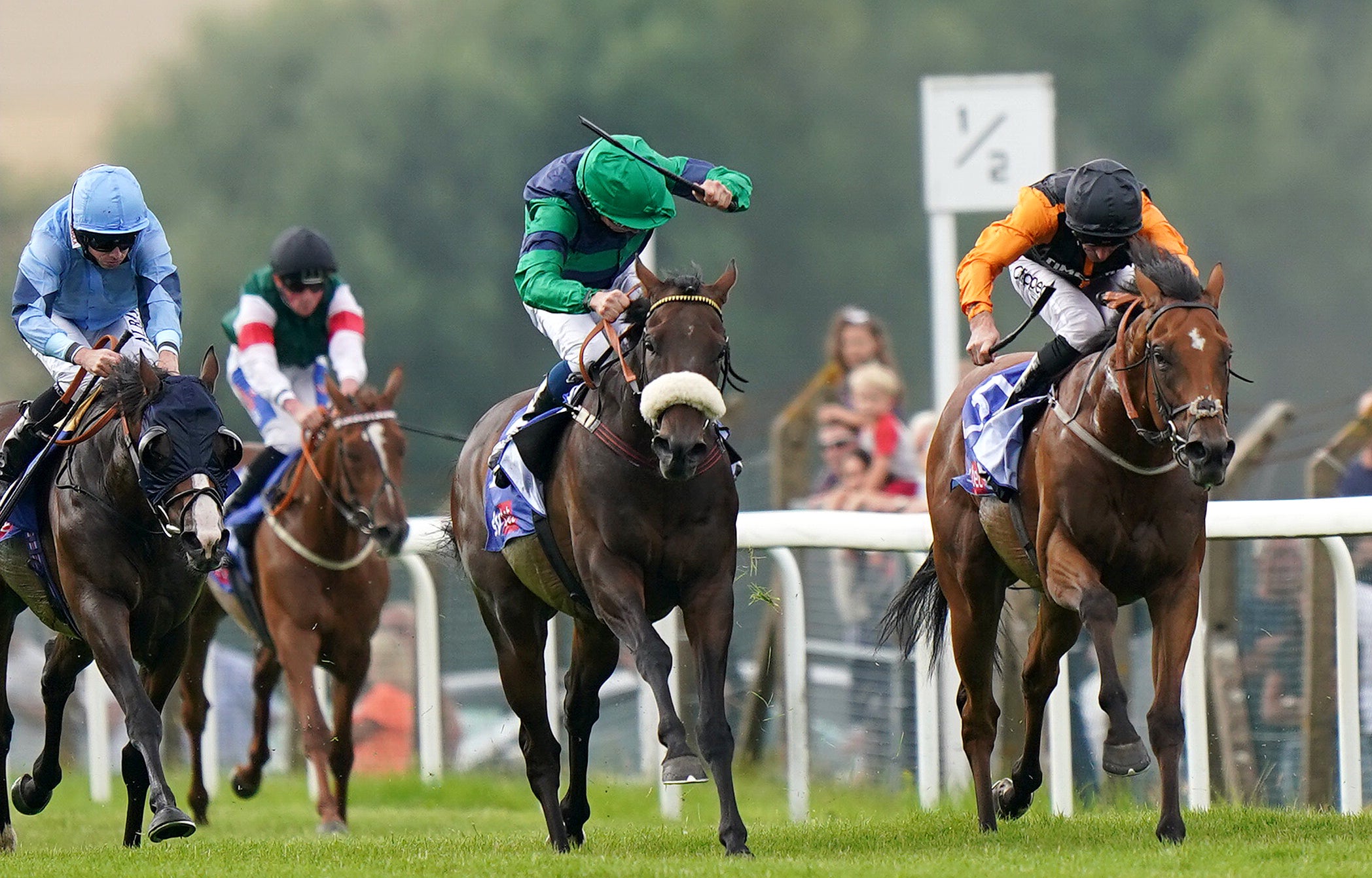 Brunch and William Buick (centre, green) coming home to win the Sky Bet Go-Racing-In-Yorkshire Summer Festival Pomfret Stakes at Pontefract (Tim Goode/PA)