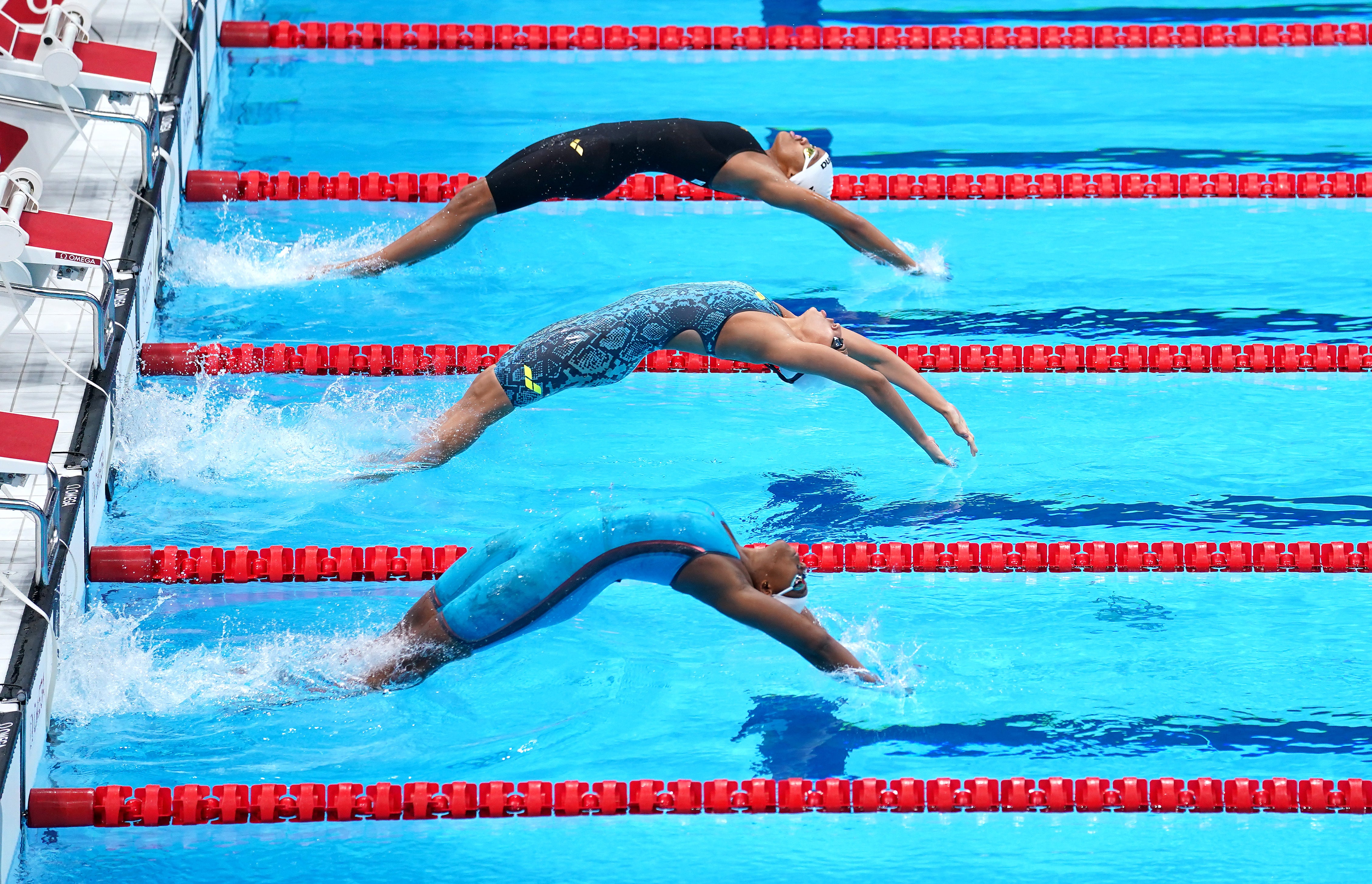 Zimbabwe’s Donata Katai, India’s Maana Patel and Grenada’s Kimberly Ince during the Women’s 100m Backstroke heats in Tokyo (Adam Davy/PA)
