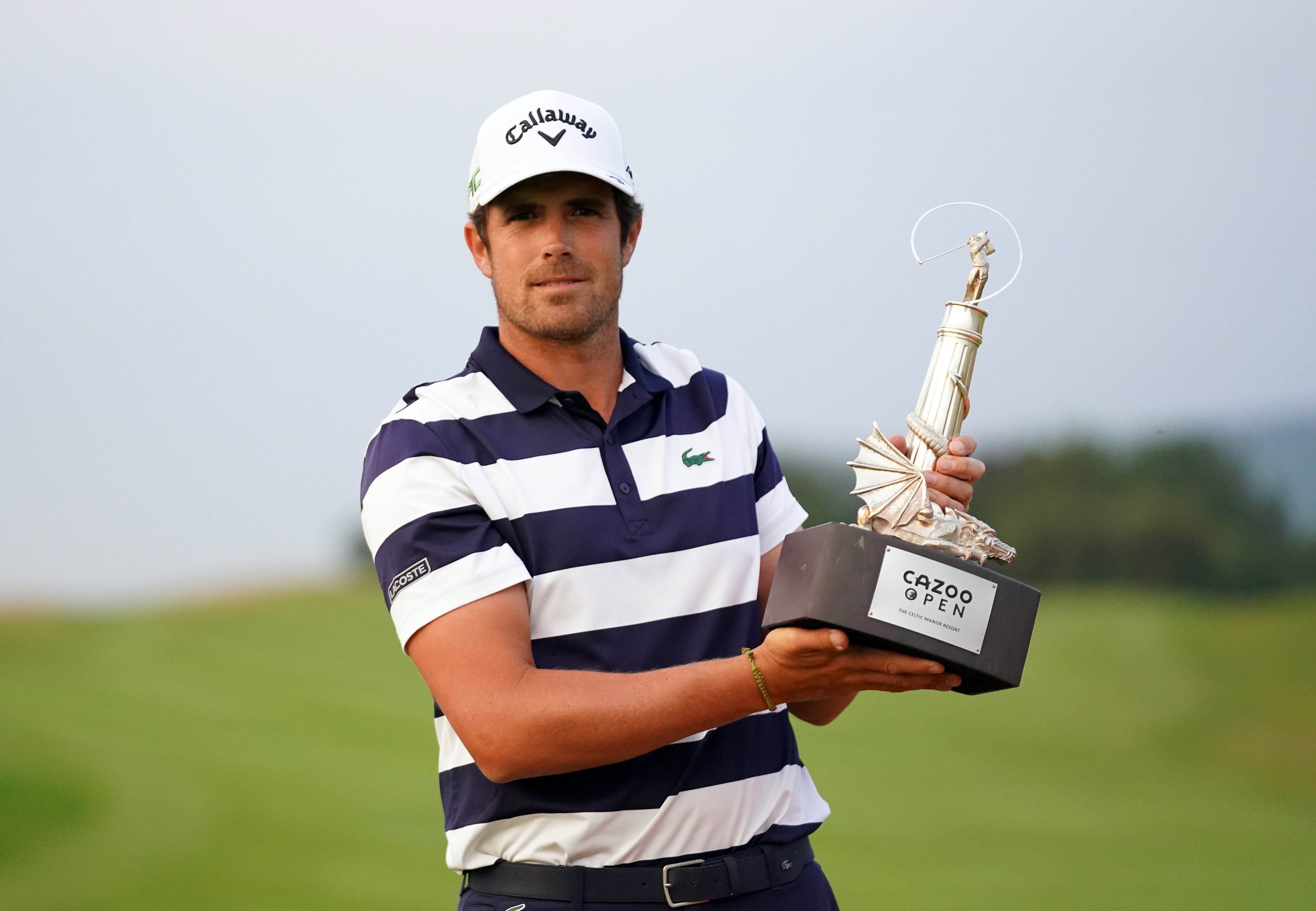 Nacho Elvira celebrates with the Cazoo Open trophy after victory over Justin Harding in a play-off at Celtic Manor (Zac Goodwin/PA)