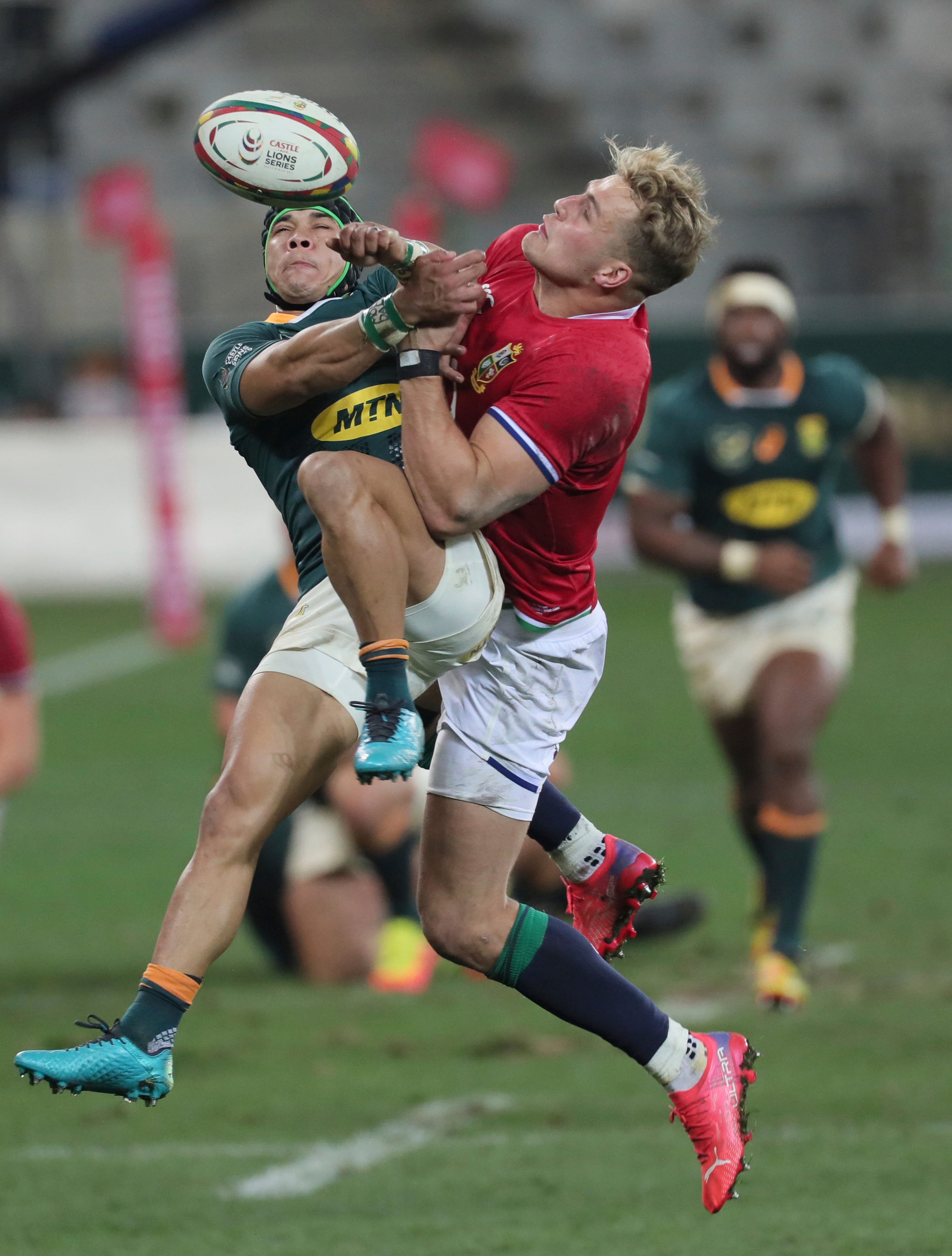 South Africa’s Cheslin Kolbe (left) and British and Irish Lions’ Duhan van der Merwe compete for a high ball in Cape Town (Halden Krog/AP/PA)