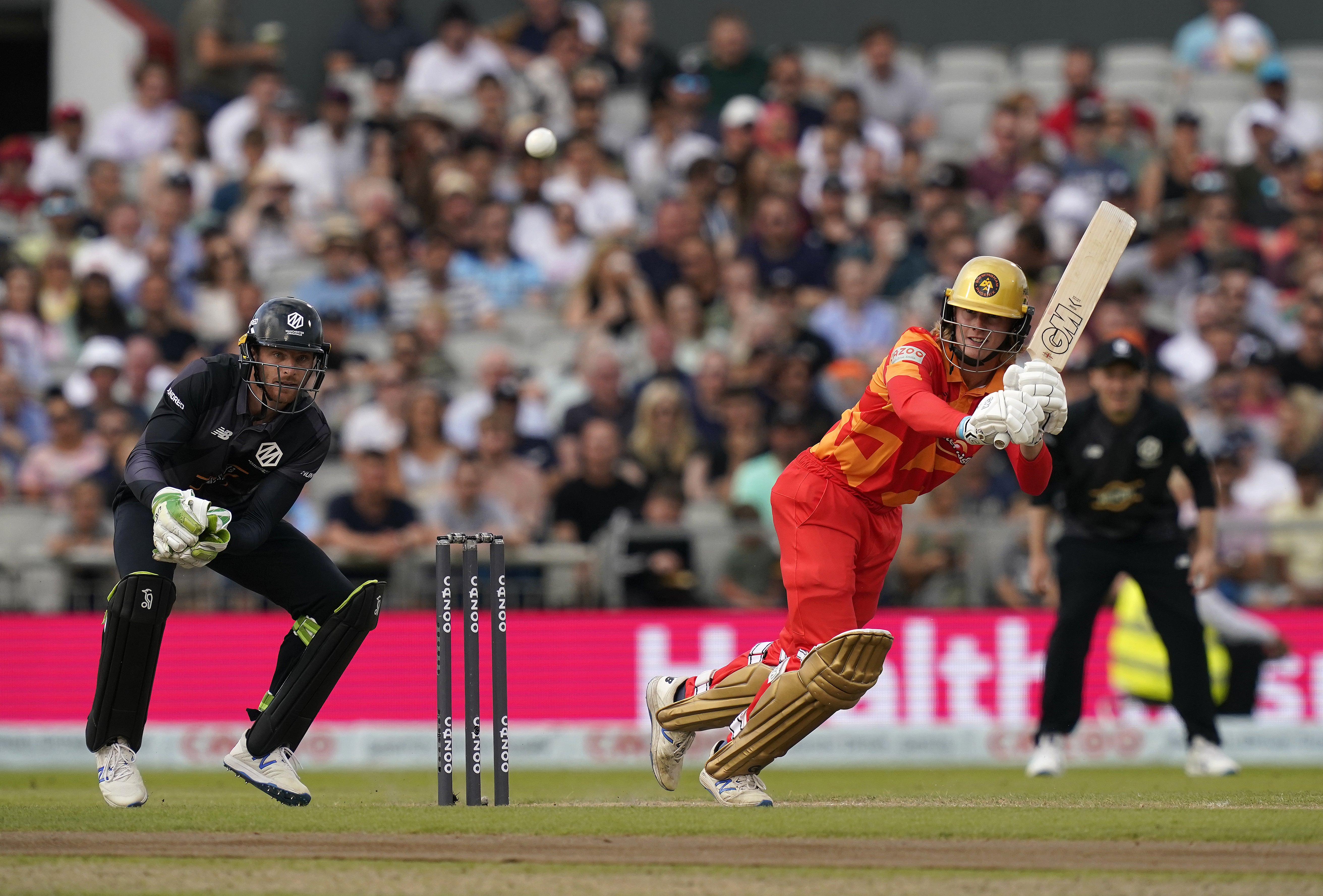 Birmingham Phoenix’s Miles Hammond (right) and Manchester Originals’ Jos Buttler in action during The Hundred match at Old Trafford (Nick Potts/PA)