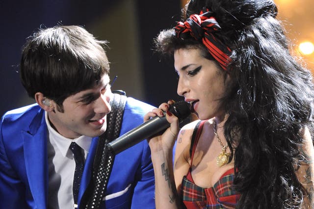 <p>Mark Ronson and Amy Winehouse perform at the Brit Awards in 2008</p>