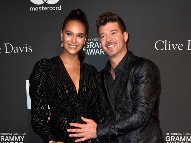 <p>Robin Thicke and April Love Geary at the Pre-Grammy Gala in 2019</p>