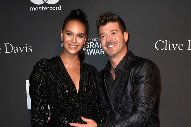 <p>Robin Thicke and April Love Geary at the Pre-Grammy Gala in 2019</p>