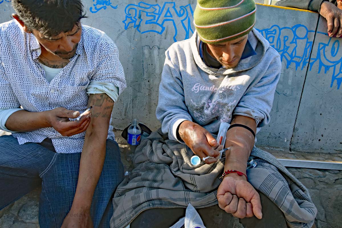 Homeless addicts roam the streets of Tijuana looking for places to get a fix