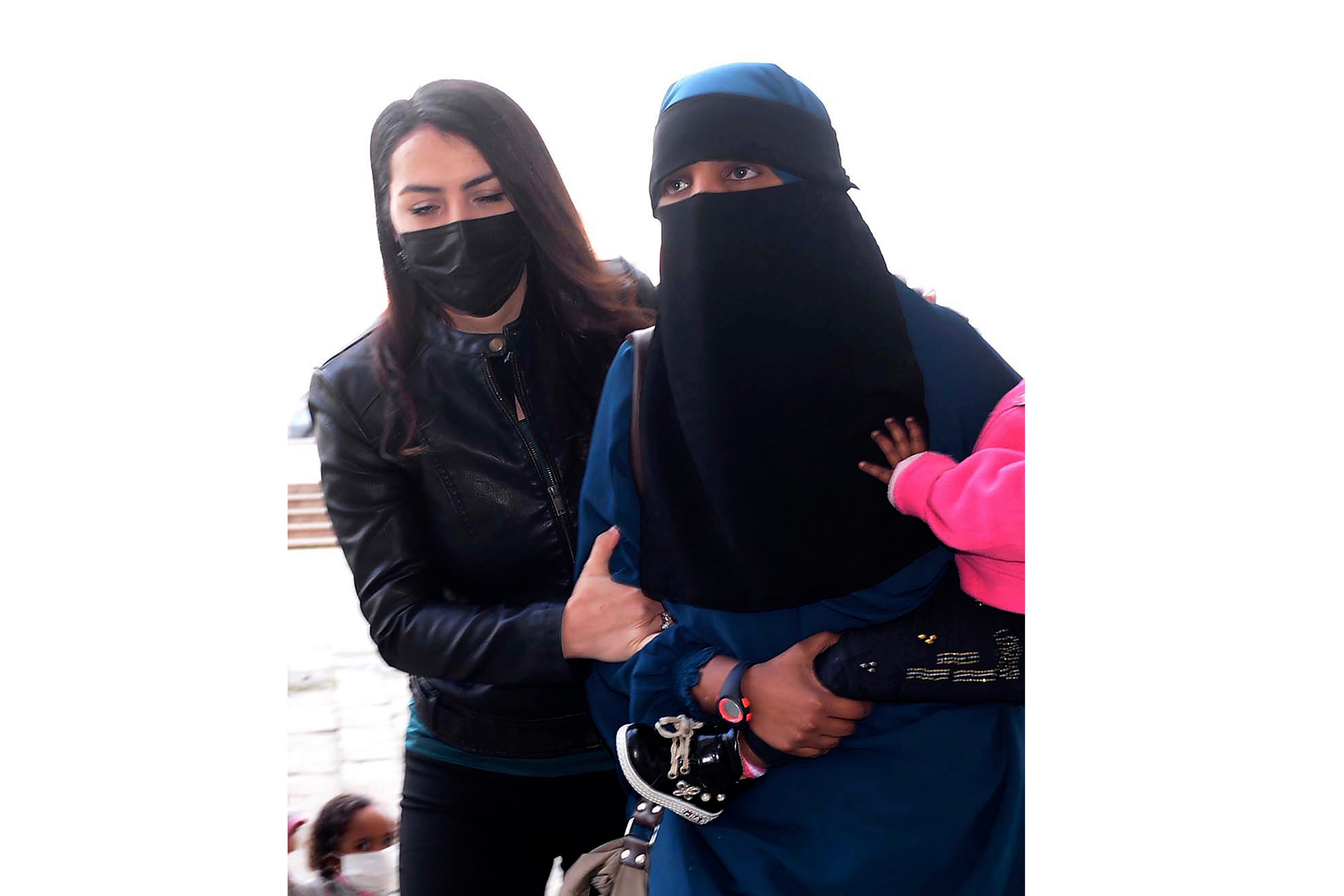 File: The woman, suspected to be linked to Isis, being escorted by Turkish police in February