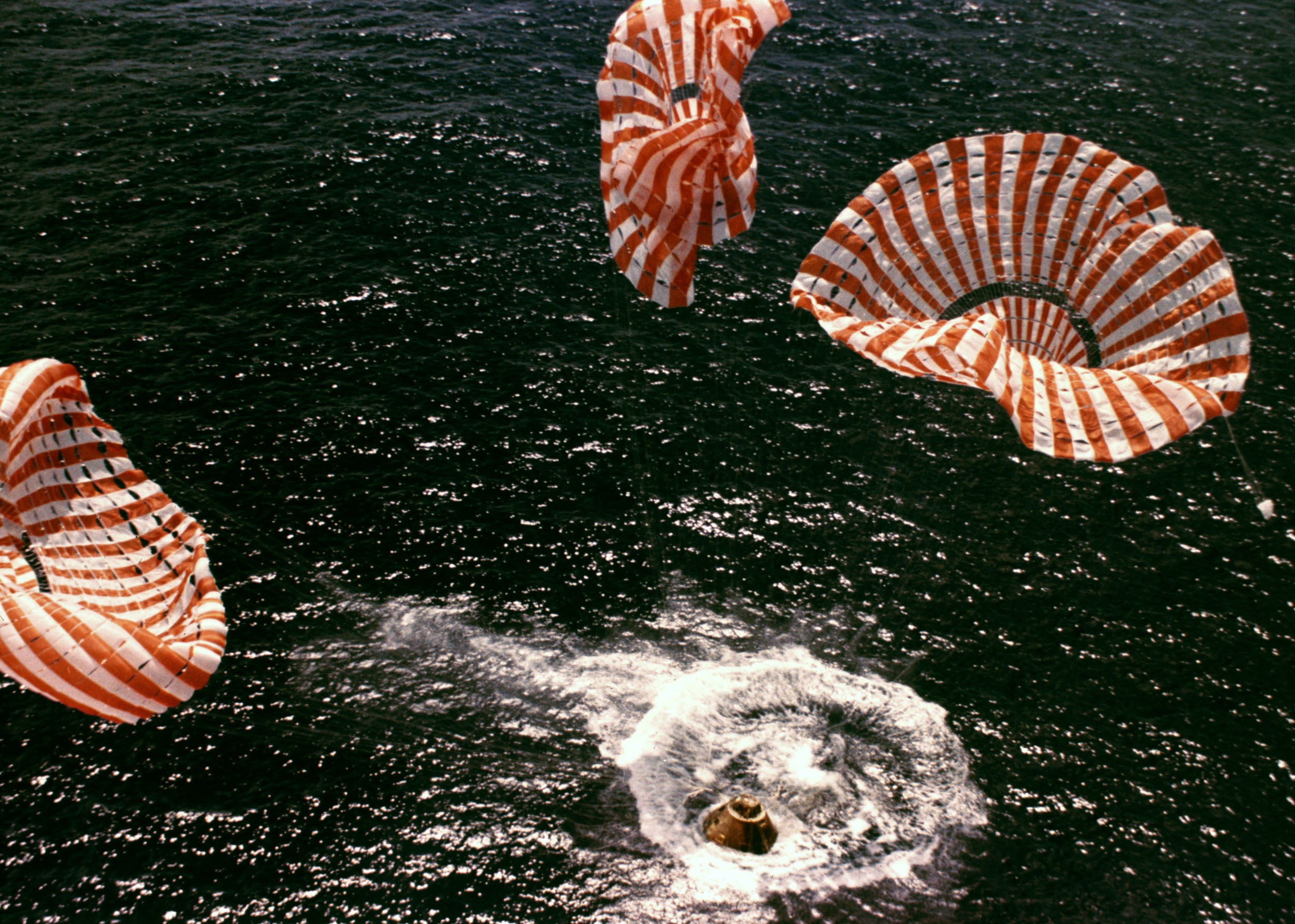 The Apollo 15 astronauts touch down in the Pacific Ocean on 7 August 1971