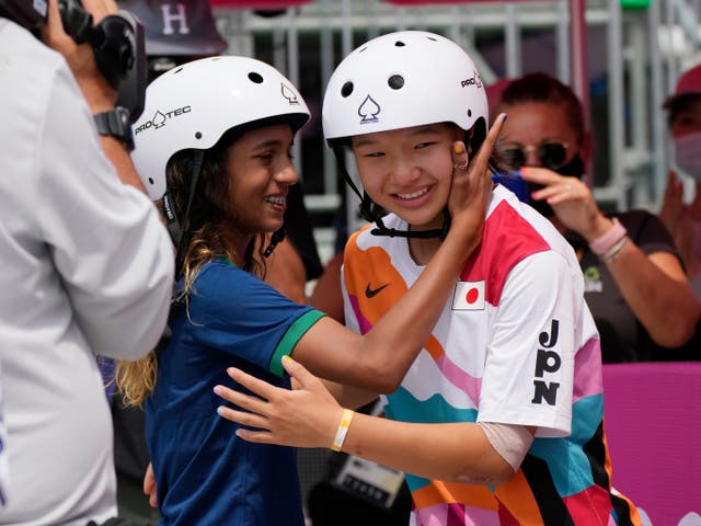 <p>Silver medalist Rayssa Leal of Brazil congratulates gold medal winner Momiji Nishiya of Japan after the women’s street skateboarding finals at the 2020 Olympics in Tokyo, Japan</p>