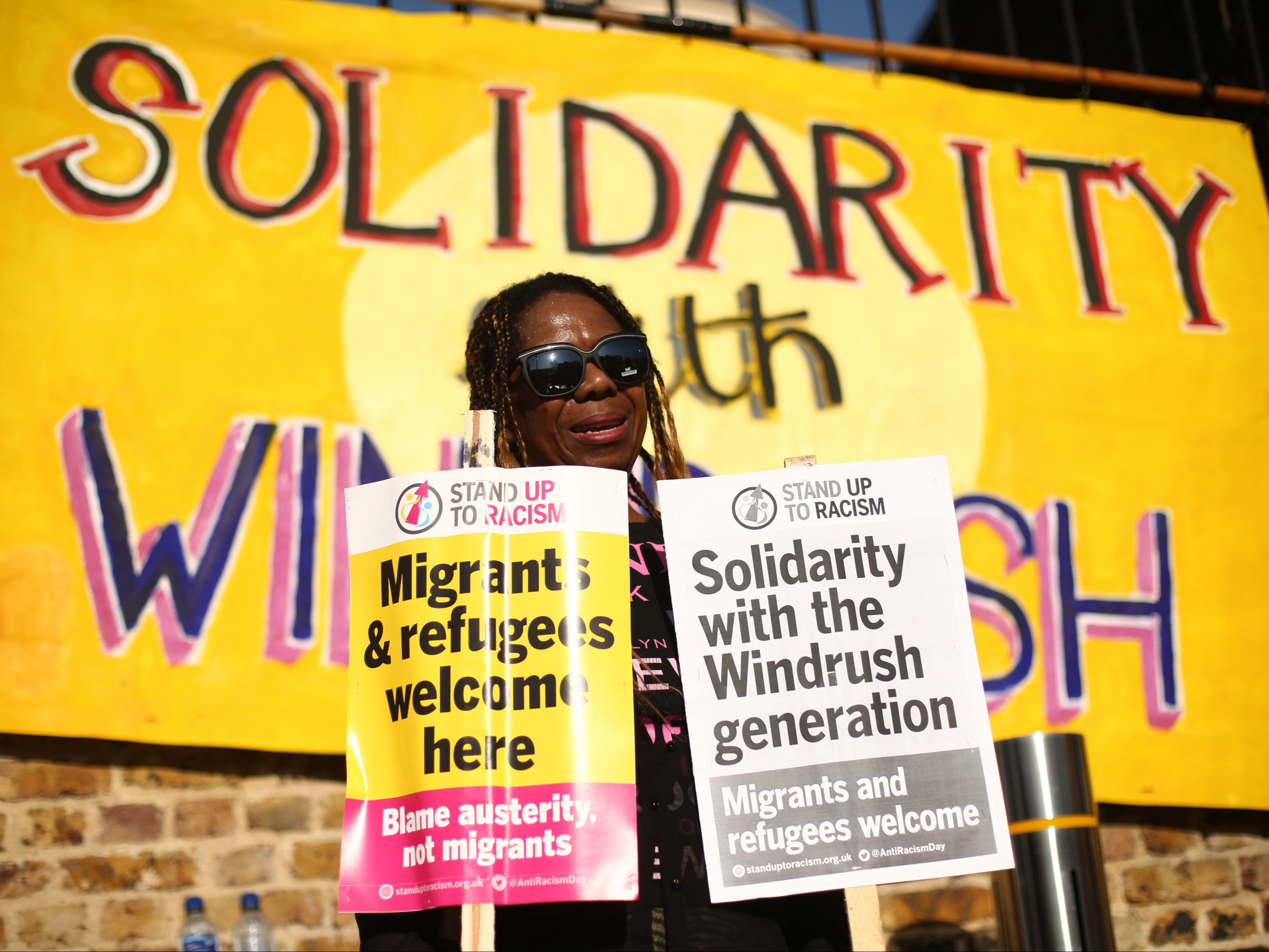 A woman at a protest in Windrush Square, Brixton, in solidarity with Windrush scandal victims