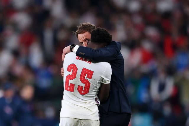 <p>England player Bukayo Saka is consoled by Gareth Southgate after his Euro 2020 penalty </p>