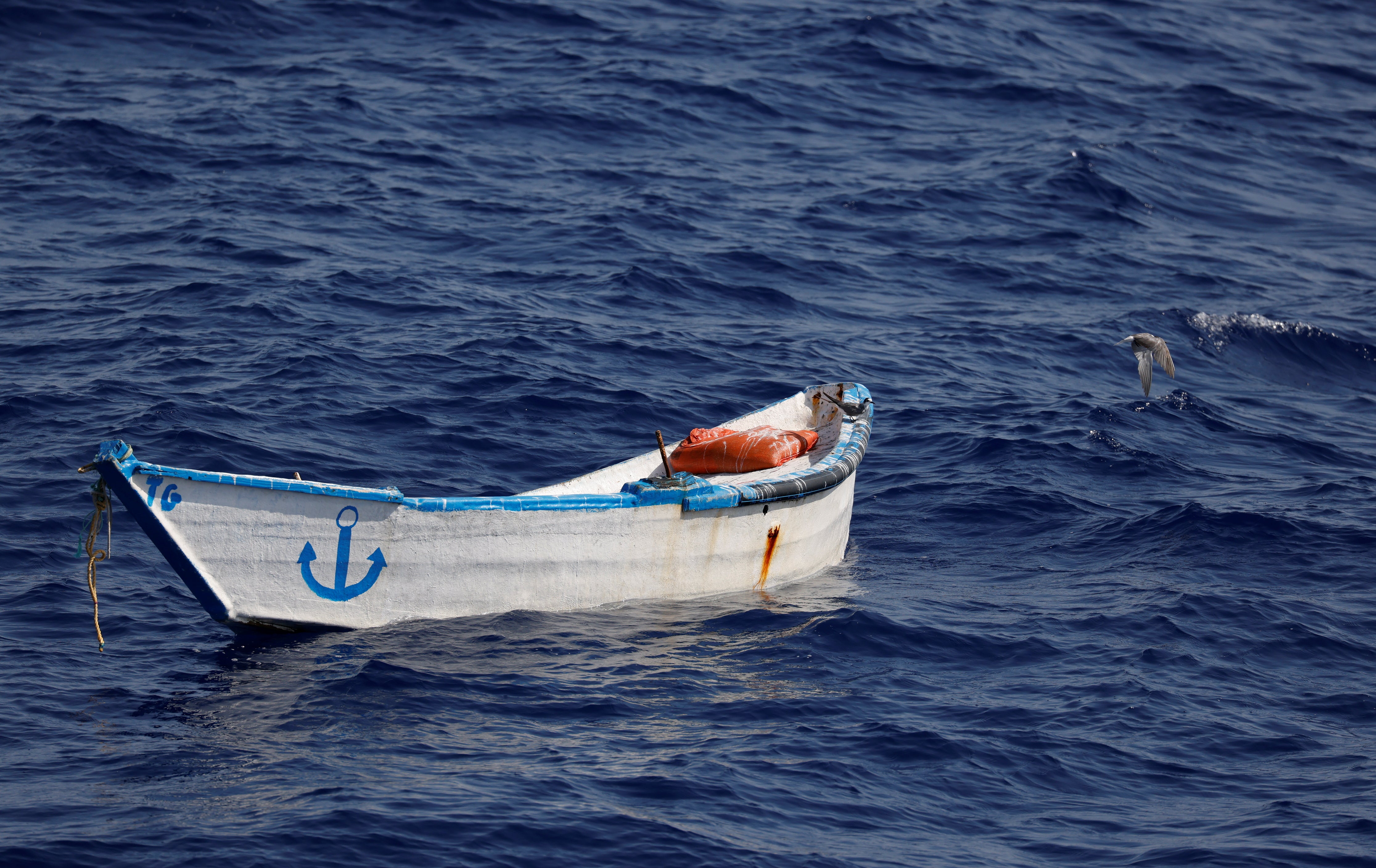 An abandoned wooden boat found by a German charity migrant rescue ship off the North African coast