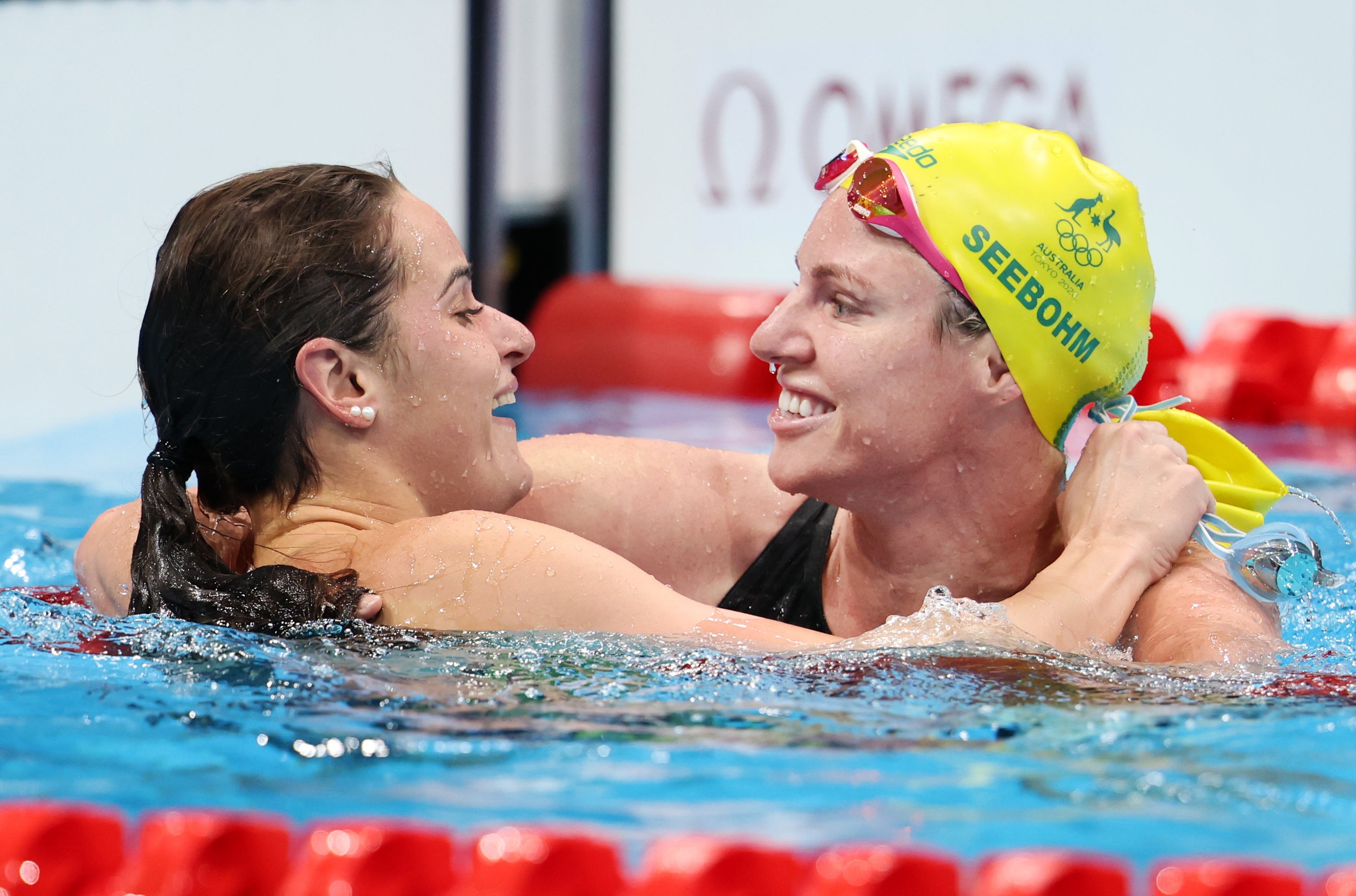 Kaylee McKeown of Team Australia is congratulated by Emily Seebohm of Team Australia after winning the gold medal in the Women’s 100m Backstroke Final on day four of the Tokyo 2020 Olympic Games at Tokyo Aquatics Centre on 27 July 2021 in Tokyo, Japan.