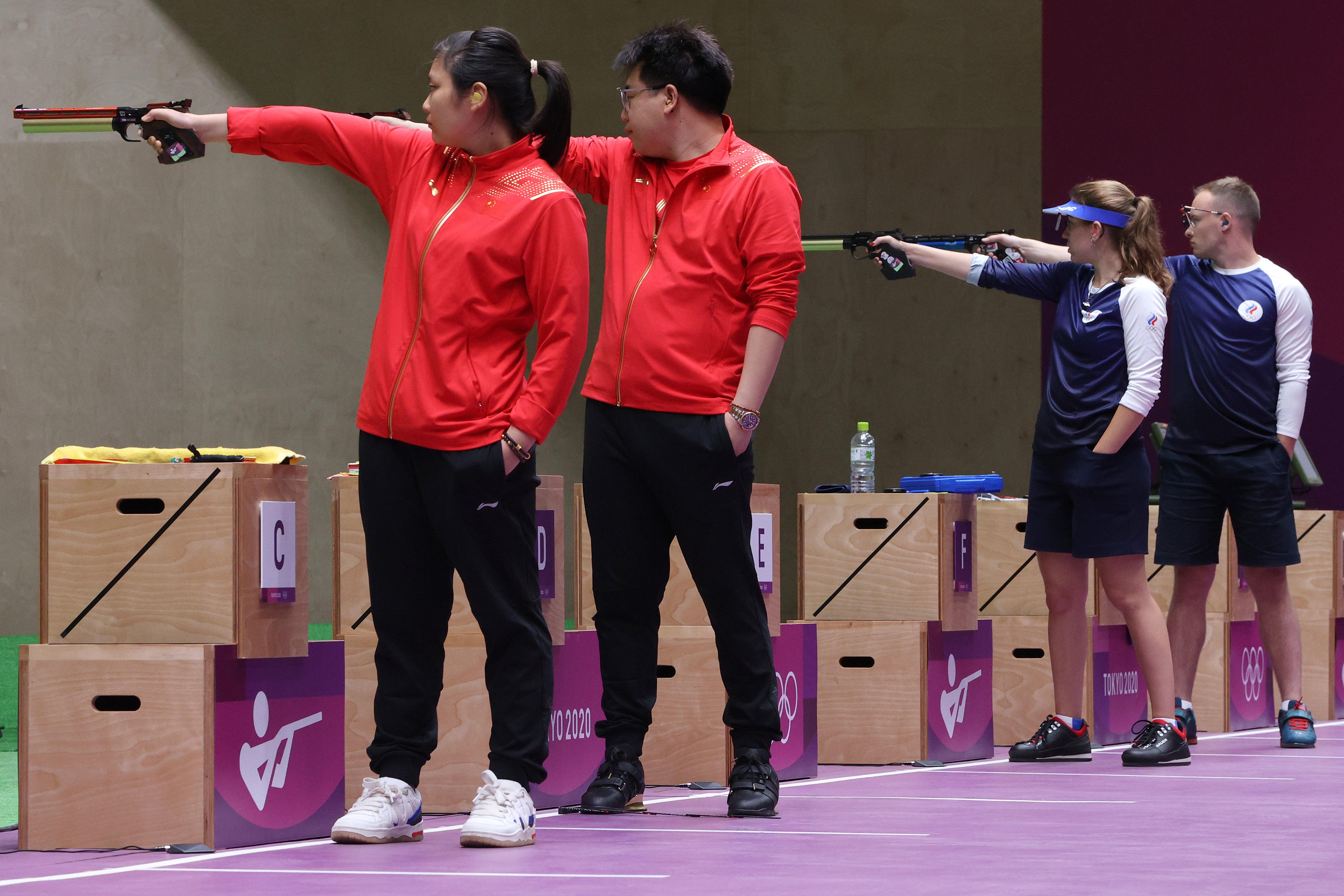 Ranxin Jiang and Wei Pang of Team China and Vitalina Batsarashkina and Artem Chernousov of Team ROC during the Gold Medal Match of the 10m Air Pistol Mixed Team event on day four of the Tokyo 2020 Olympic Games at Asaka Shooting Range on 27 July 2021 in Asaka, Saitama, Japan