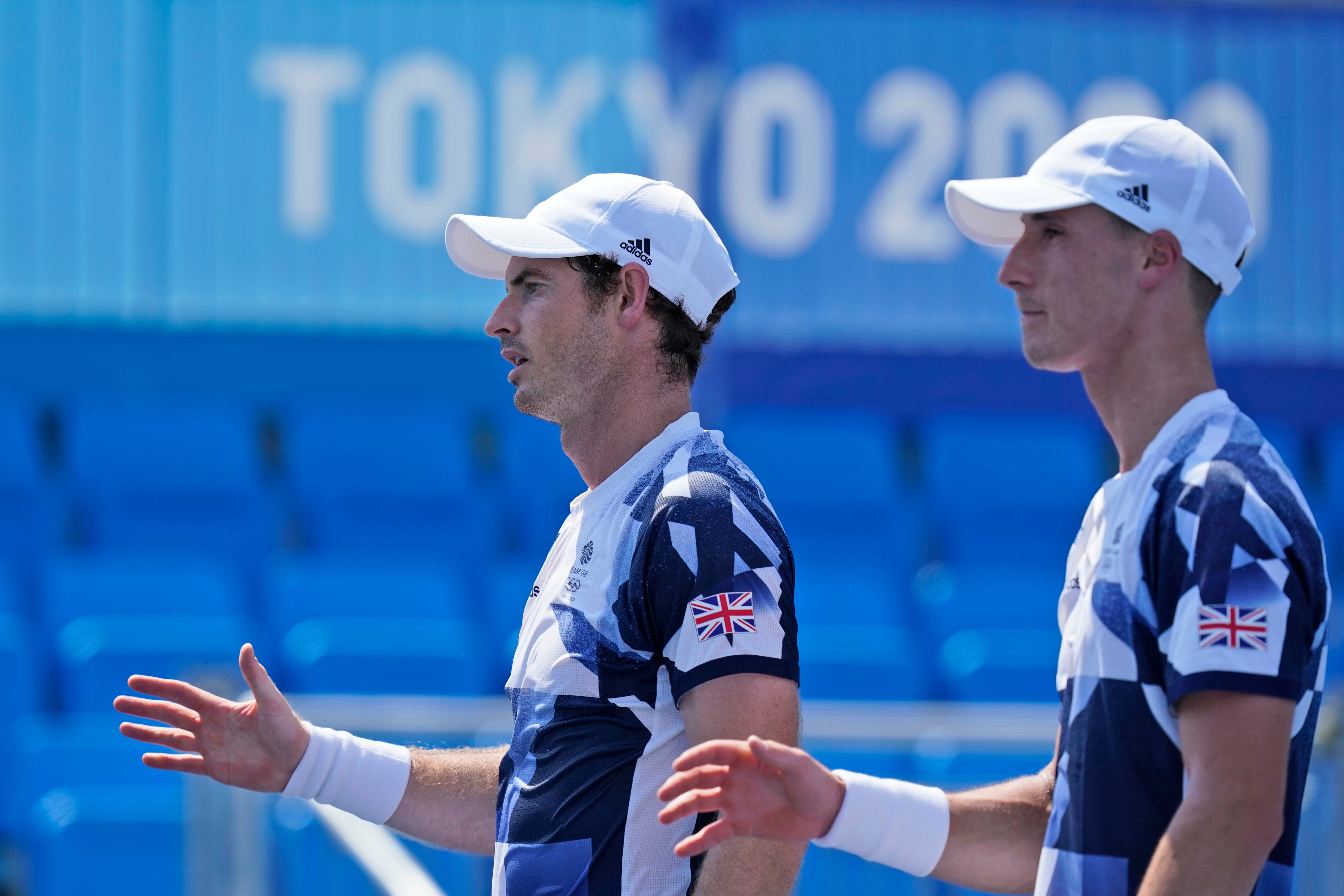 The British doubles team of Joe Salisbury, right, and Andy Murray, second from right, greet the French doubles team after defeating them during the first round of the tennis competition at the 2020 Summer Olympics, Saturday, 24 July 2021, in Tokyo, Japan