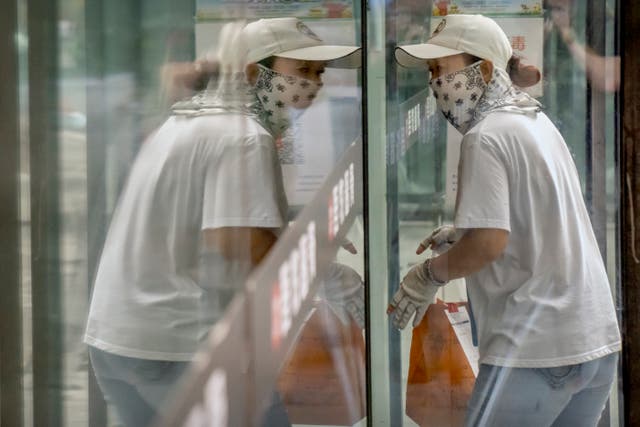 APTOPIX Virus Outbreak China Daily Life