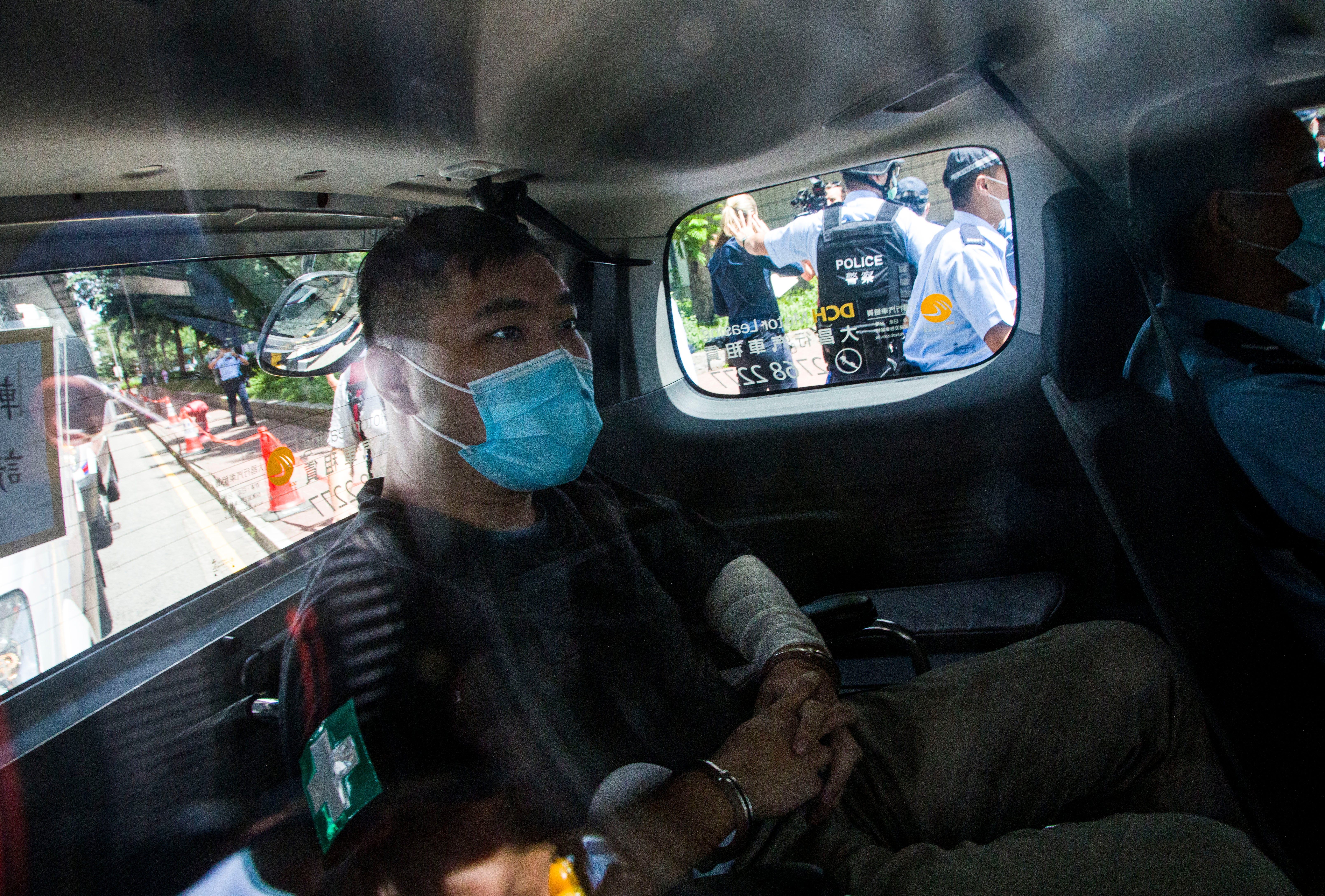 File: Hong Kong defendant Tong Ying-Kit, 24, arrives at court after being accused of deliberately driving his motorcycle into a group of police officers last Wednesday on 6 July, 2020