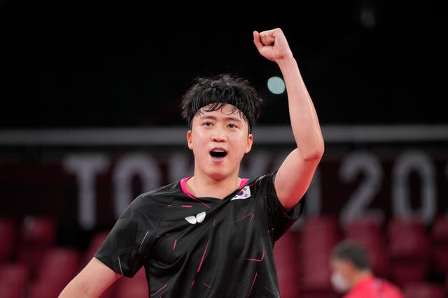 <p>Jeoung Young-sik celebrates after defeating Greek player Panagiotis Gionis in Round 3 of the men’s table tennis singles competition</p>