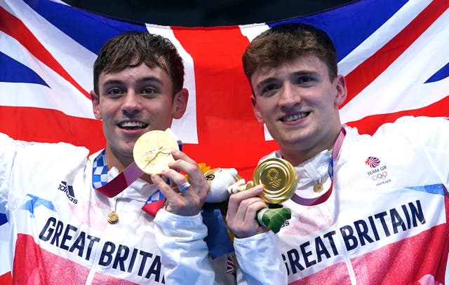<p>Great Britain’s Tom Daley (left) and Matty Lee celebrate winning gold in the Men’s Synchronised 10m Platform Final at the Tokyo Aquatics Centre on the third day of the Tokyo 2020 Olympic Games in Japan. Picture date: Monday July 26, 2021.</p>