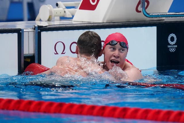 Great Britain’s Tom Dean, right, celebrates with runner-up Duncan Scott (Adam Davy/PA)