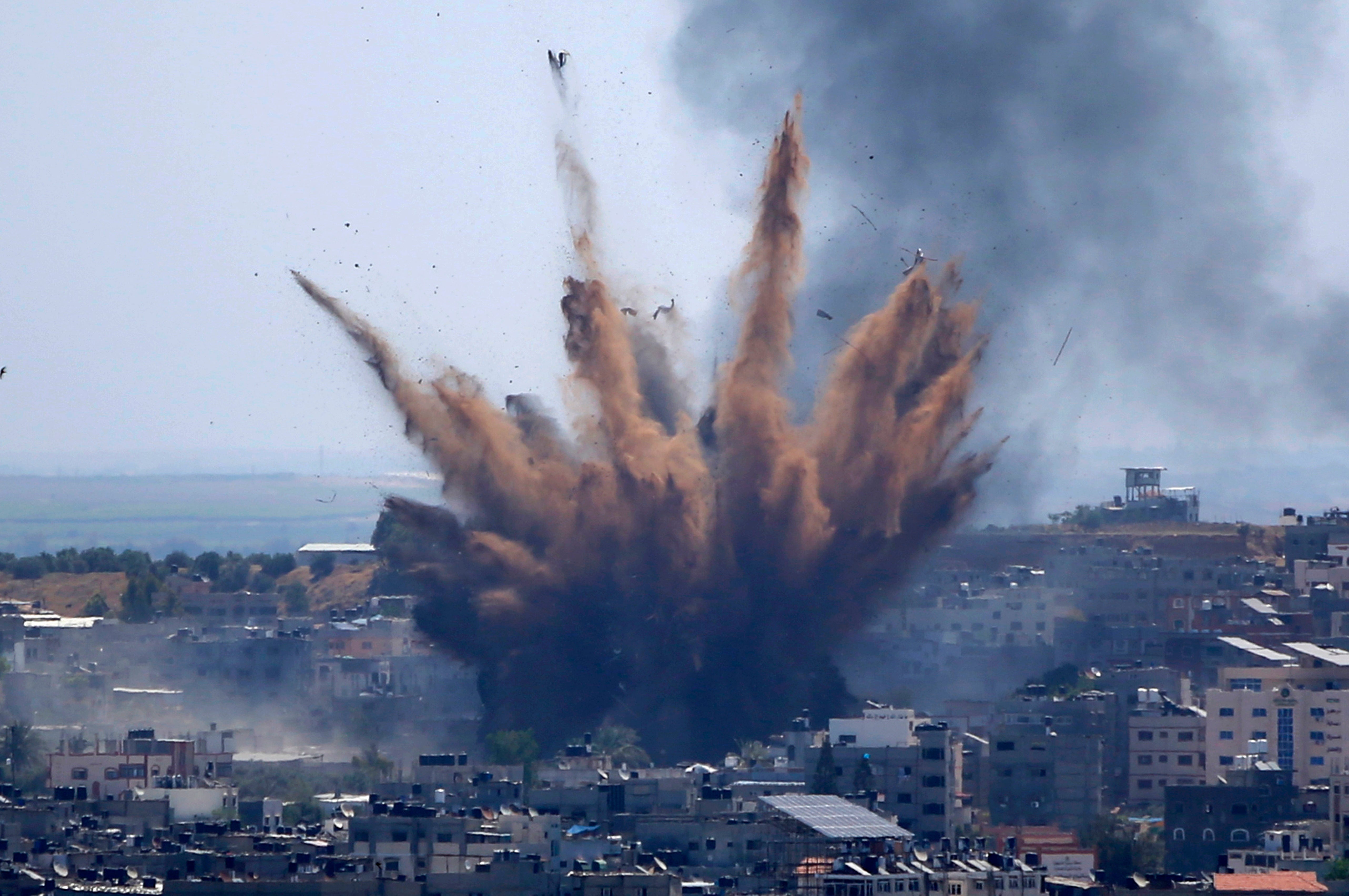Smoke rises following Israeli airstrikes on a building in Gaza City in May