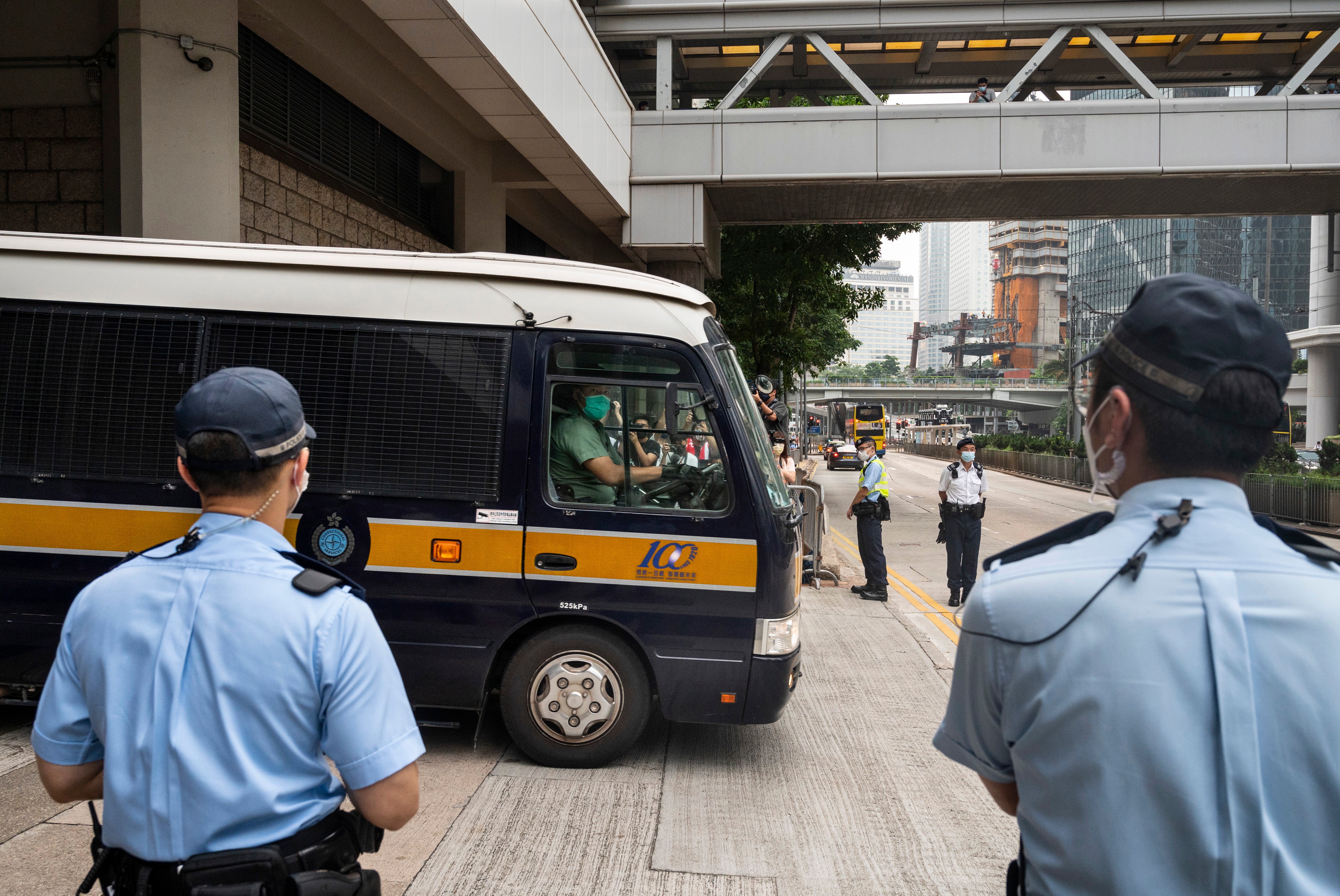 A Correction Services Department van thought to carry Tong Ying-kit, convicted under the Hong Kong National Security Law, leaves the High Court in Hong Kong