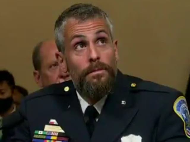 <p>Capitol Police Officer Michael Fanone watches footage of the 6 January insurrection during the House select committee hearing on the Capitol riot.</p>