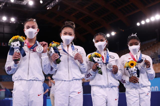 <p>Grace McCallum, Sunisa Lee, Jordan Chiles and Simone Biles of Team United States celebrate after winning the silver medal during the Women's Team Final on day four of the Tokyo 2020 Olympic Games at Ariake Gymnastics Centre on 27 July 2021 in Tokyo, Japan</p>