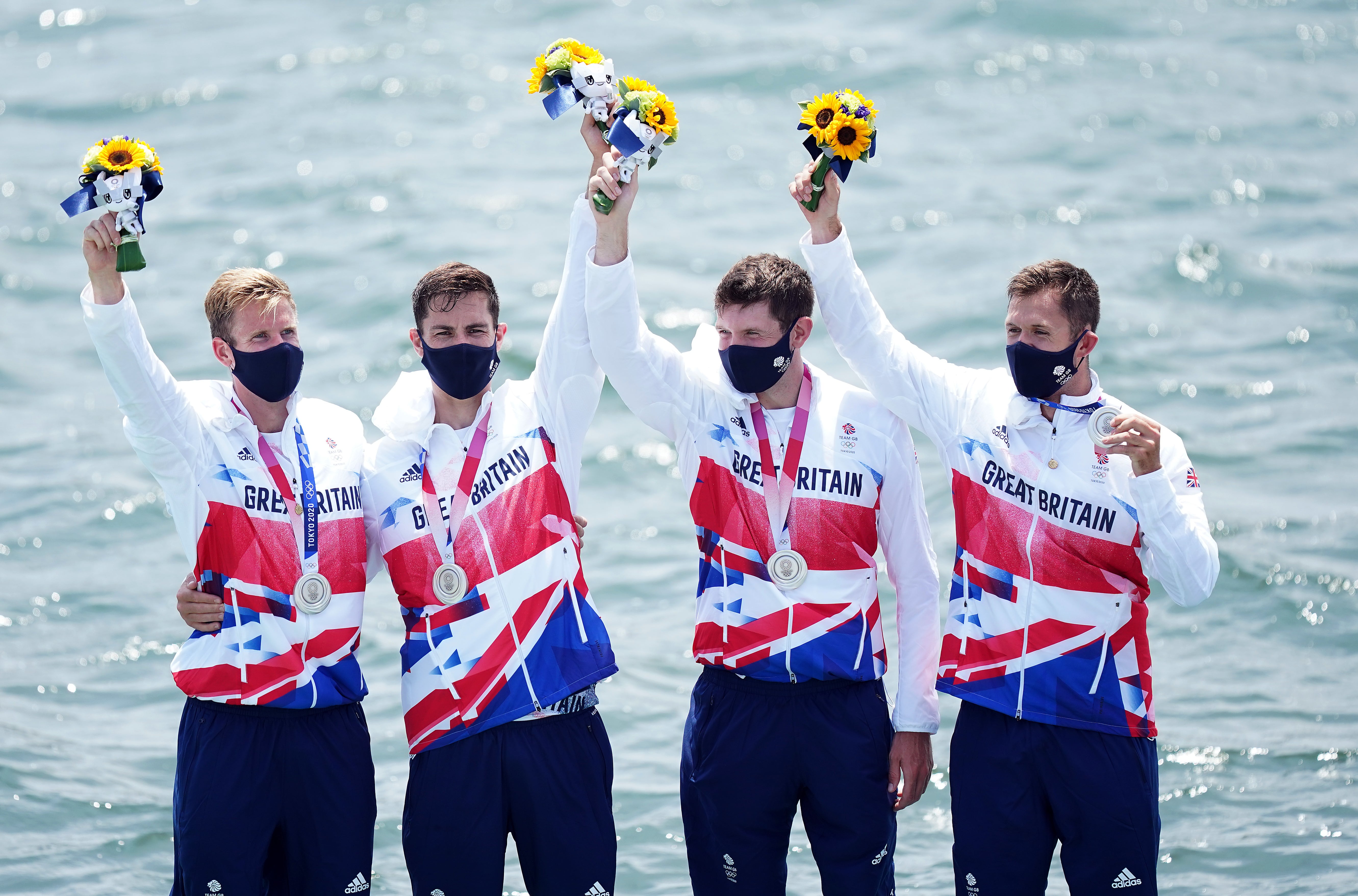 Great Britain’s Harry Leask, Angus Groom, Tom Barras and Jack Beaumont collect their silver medals (Mike Egerton/PA)