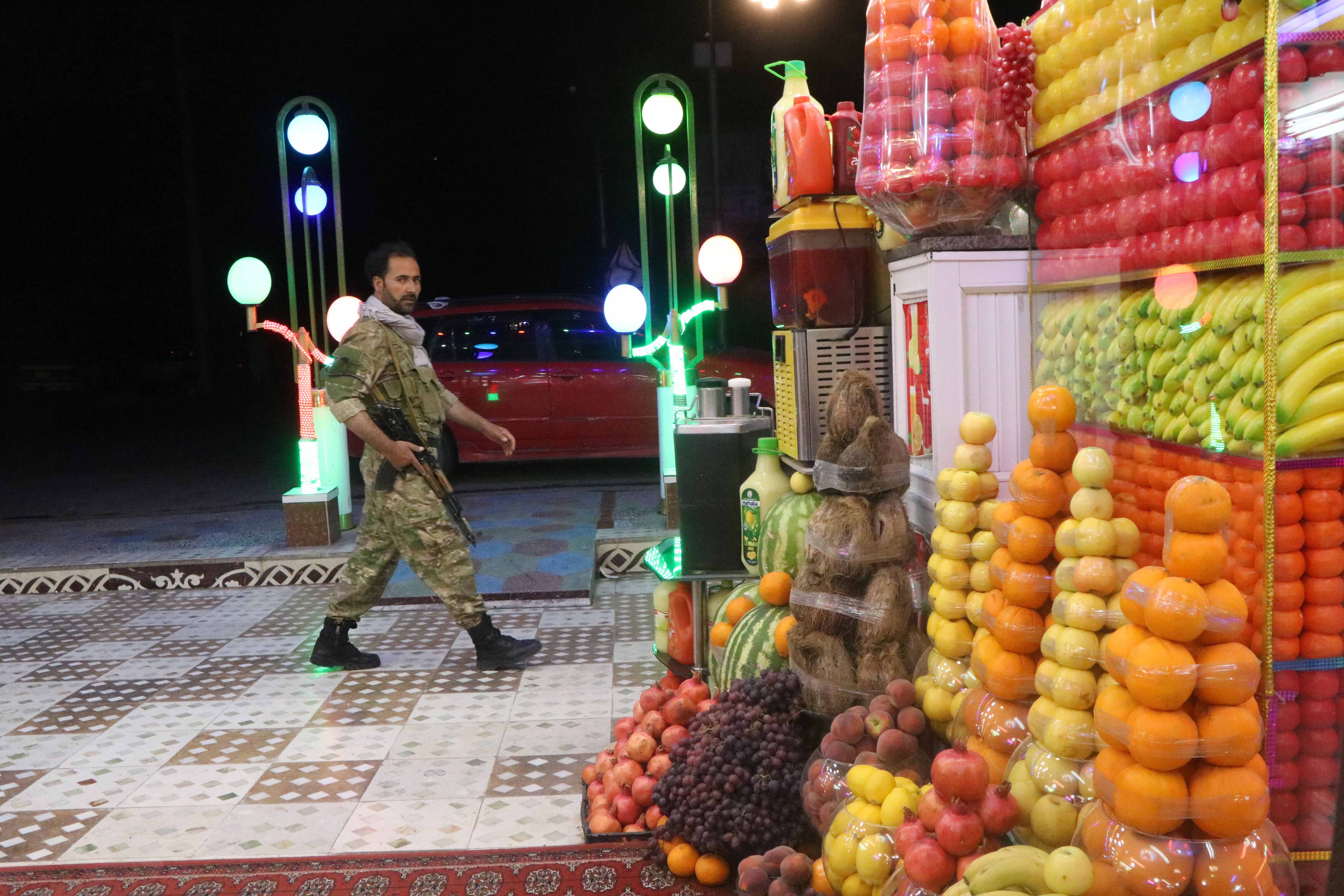 An Afghan security official patrols after Afghan authorities imposed a night curfew in 31 of the 34 provinces in Afghanistan, in Herat, Afghanistan, 28 July 2021