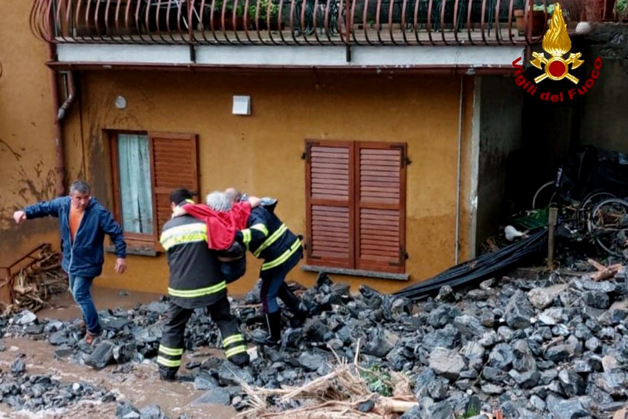 An elderly woman rescued by firefighters from her home