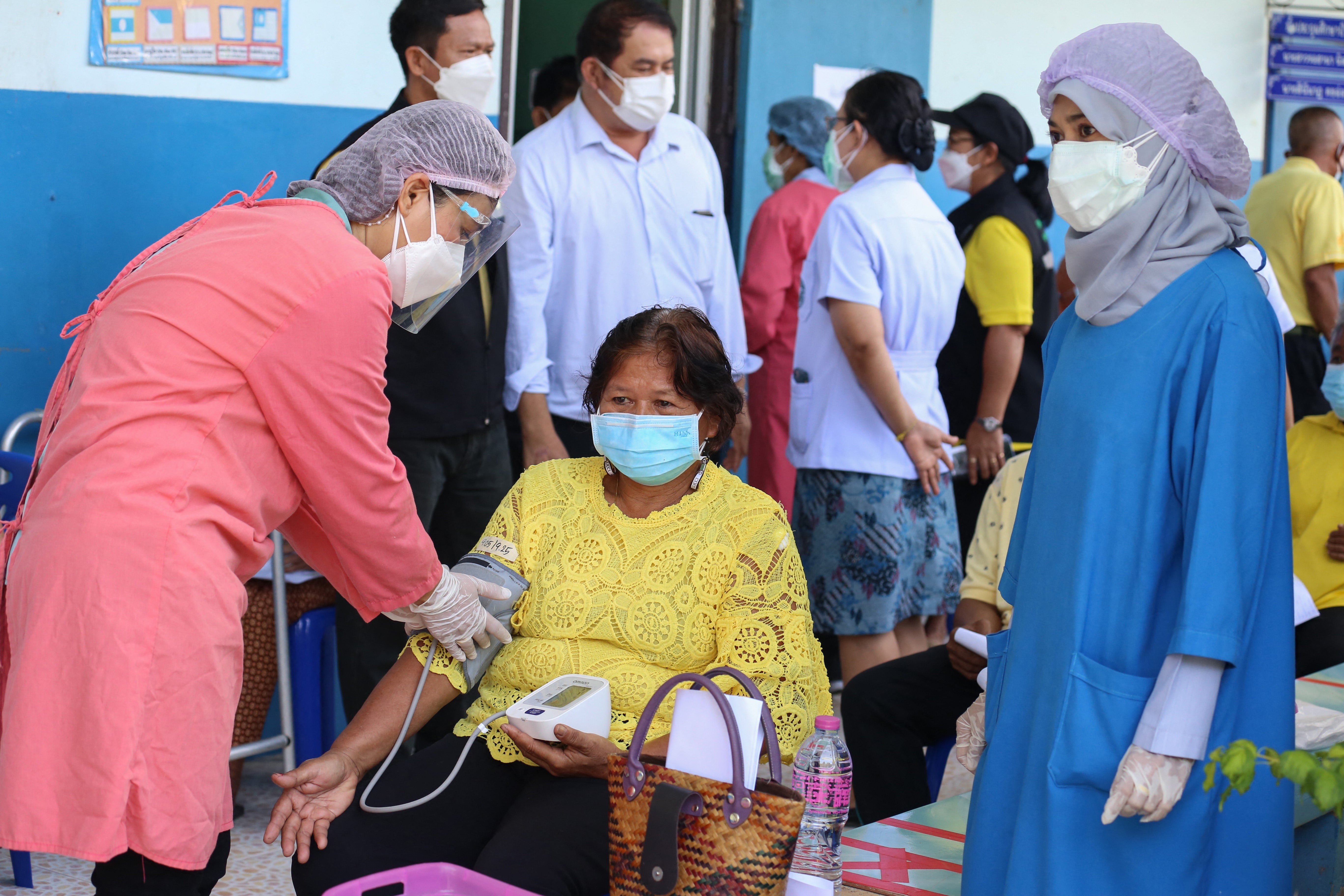 <p>A woman gets her blood pressure checked as officials at Khok Pho Hospital prepare to administer the AstraZeneca vaccine for Covid-19 to some 200 people</p>