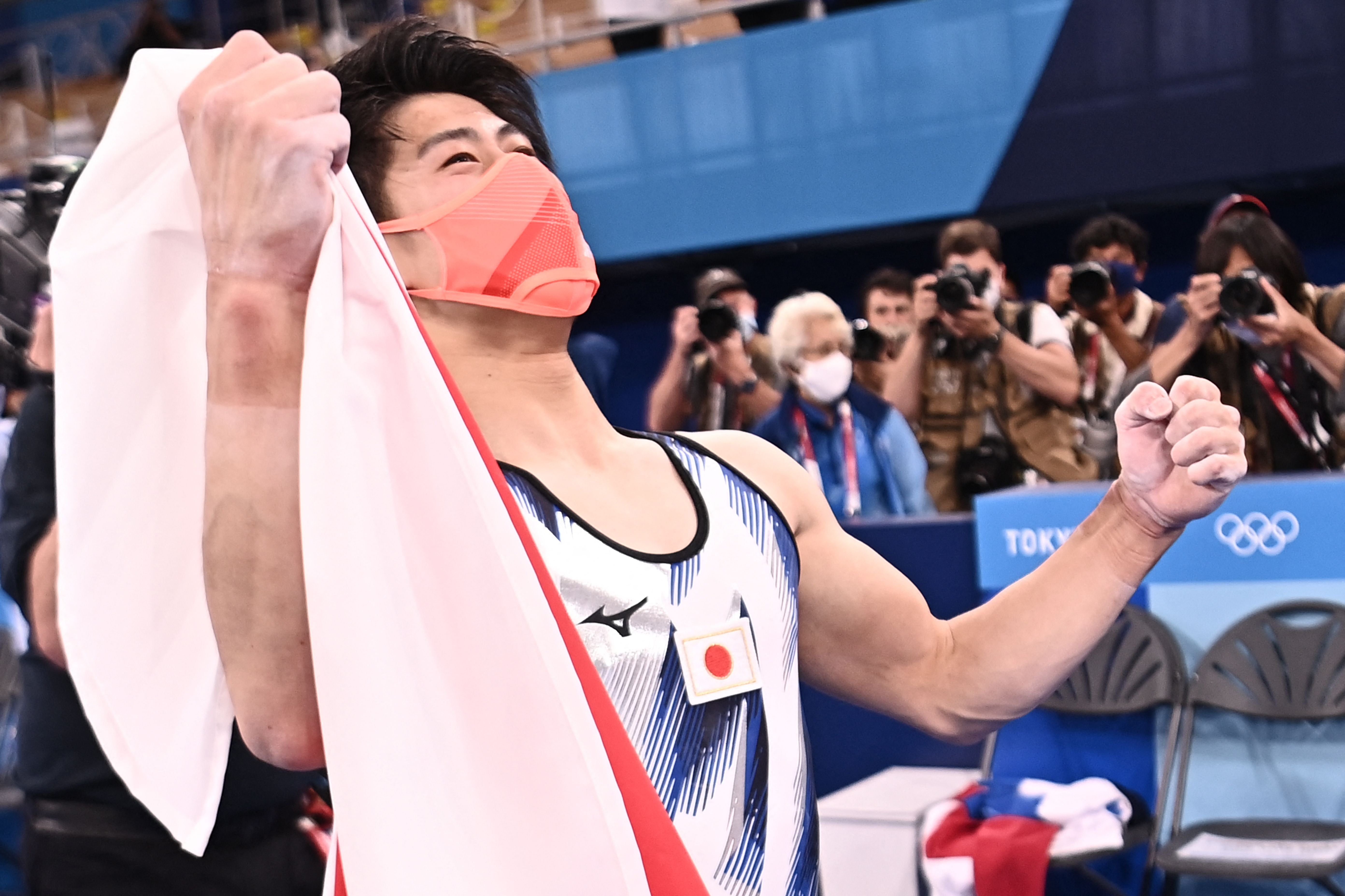 Daiki Hashimoto celebrates winning the men’s all-around final